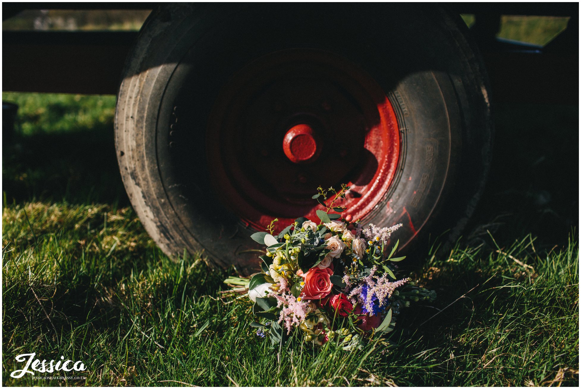 bouquet laid in front of farm wheel in north wales