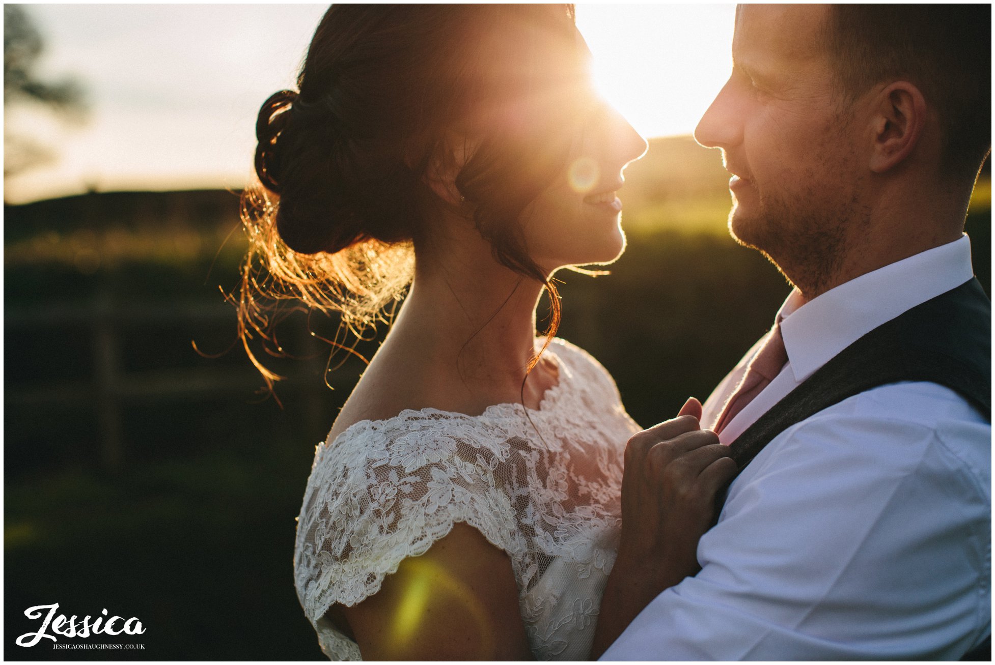 bride gazes at groom in the evening sun at tower hill barns wedding venue