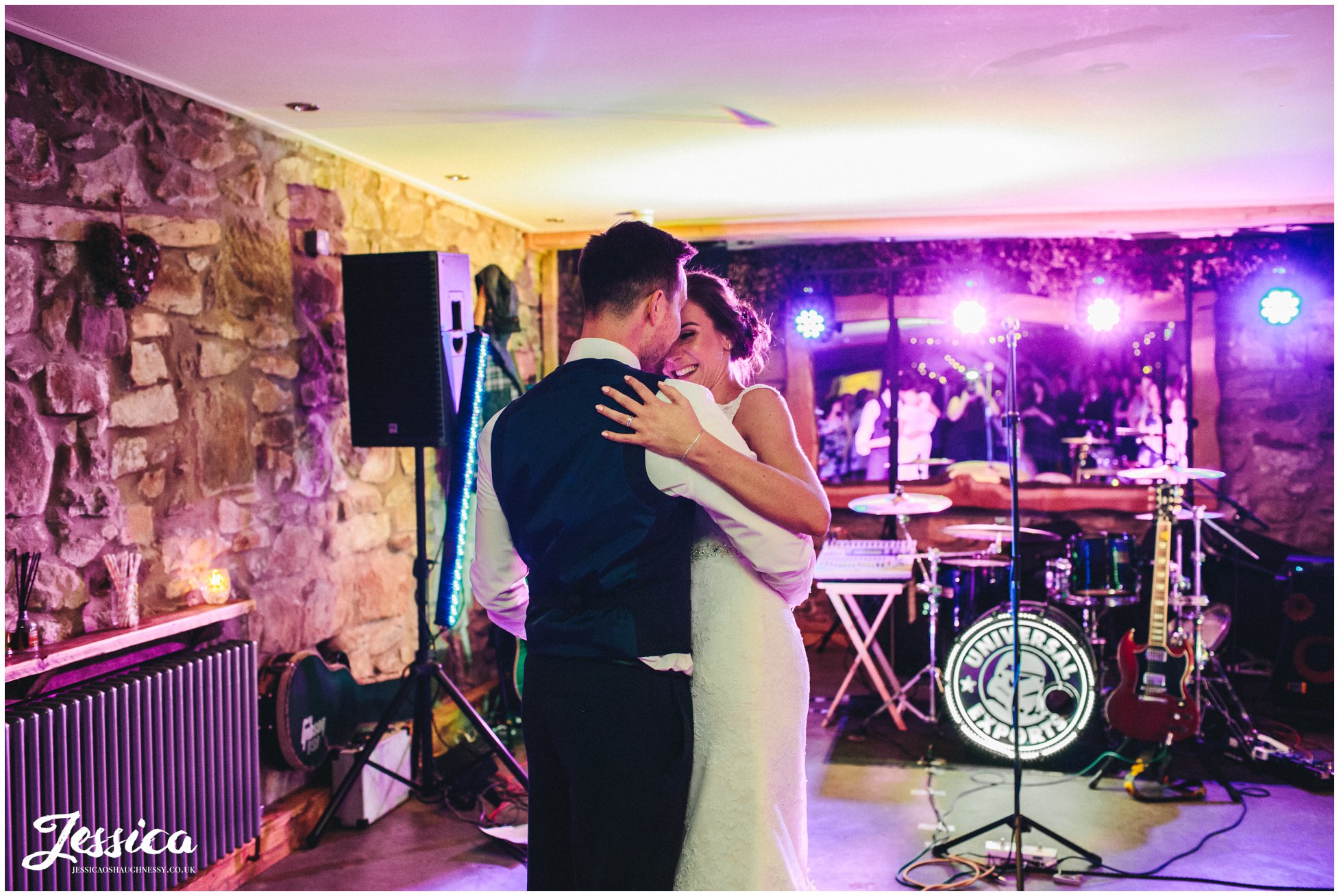 bride & groom share first dance in the barn - north wales wedding photographer