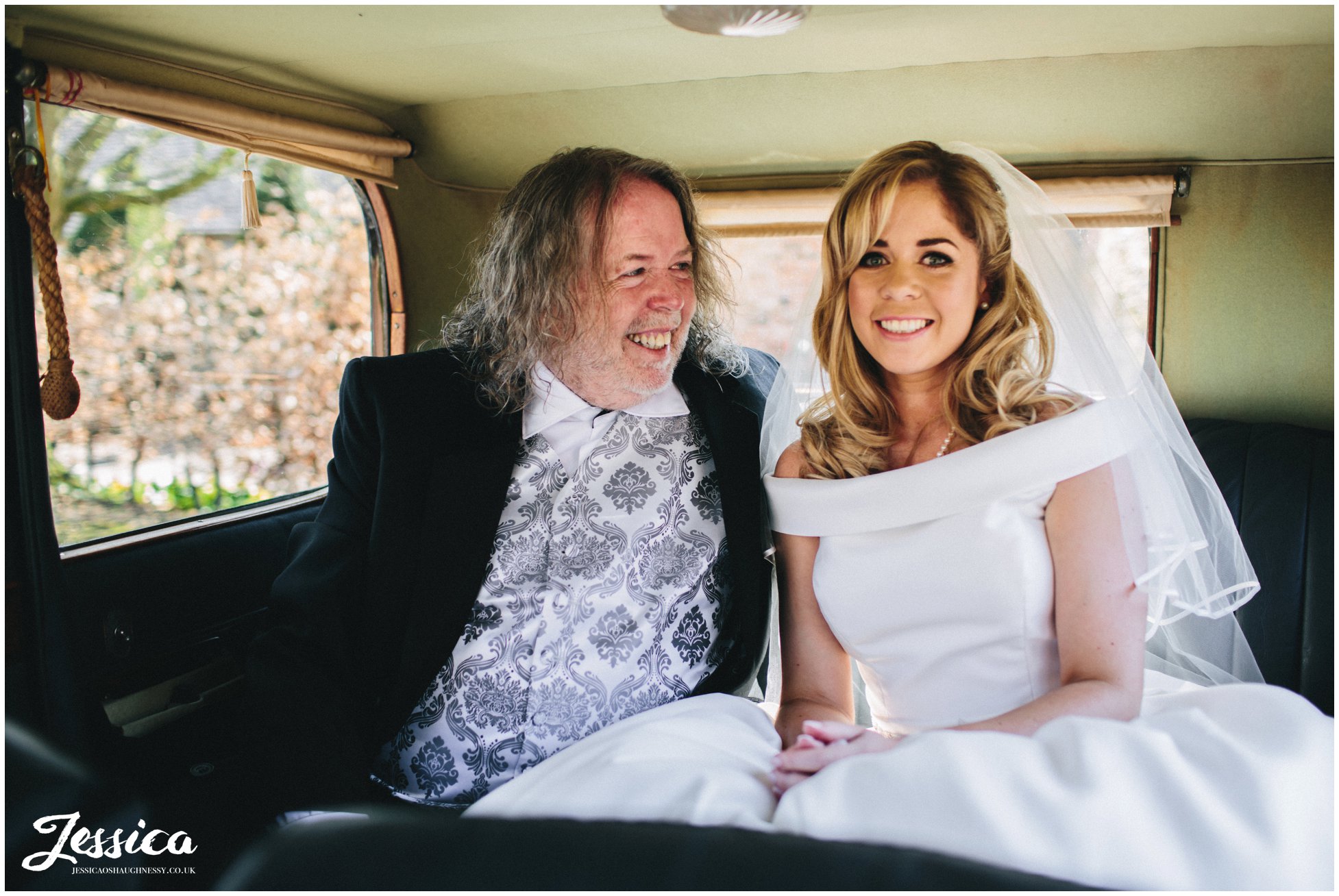 bride & her father in the Combermere Abbey wedding car, shropshire