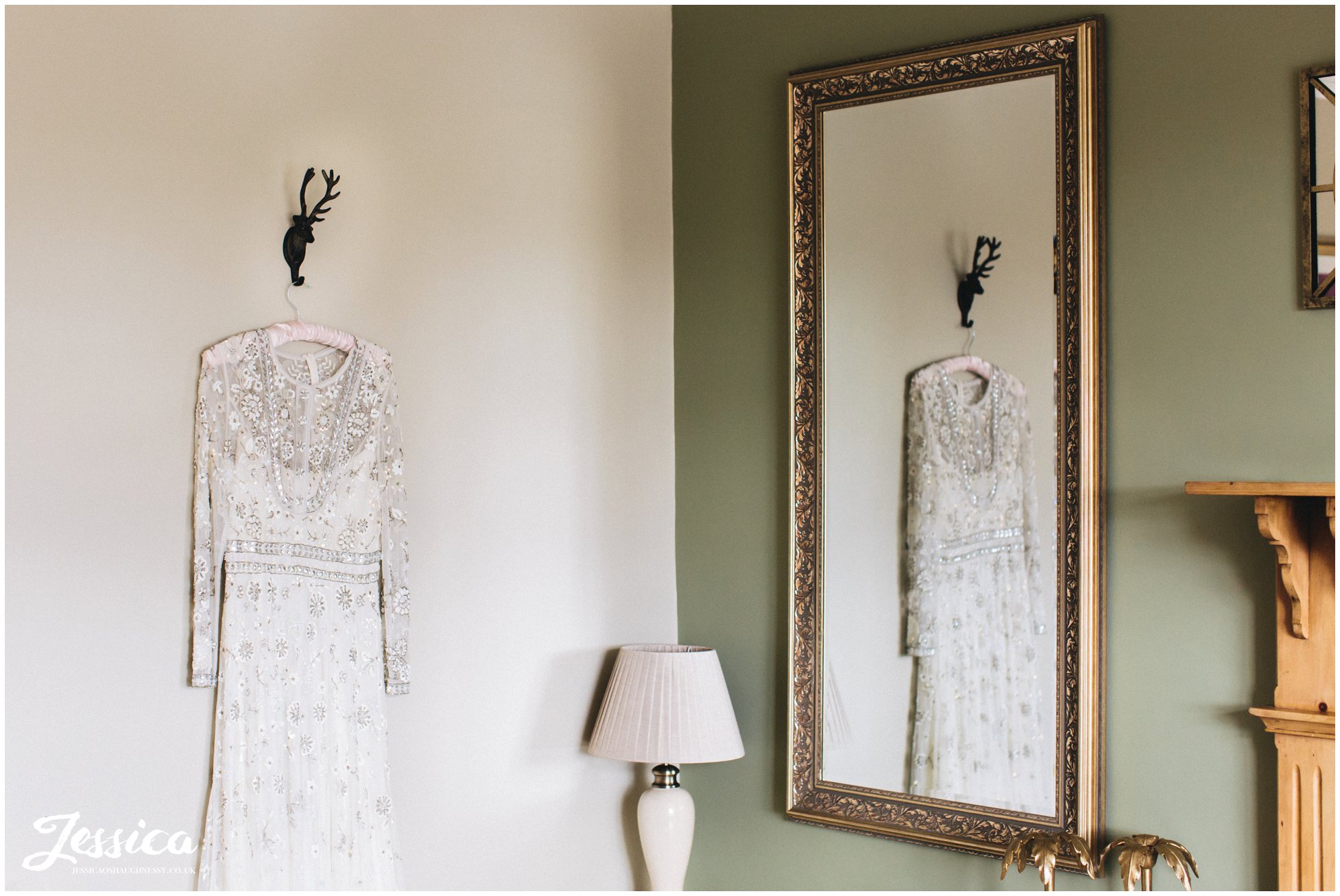 wedding dress hanging in the cottages at tower hill barns