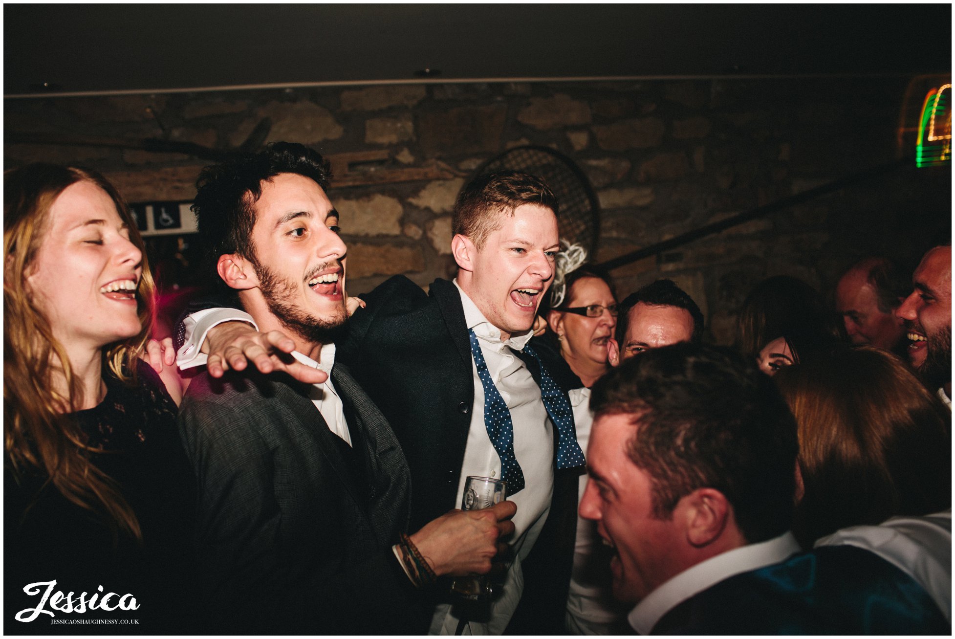 groom dances with friends during his wedding in north wales