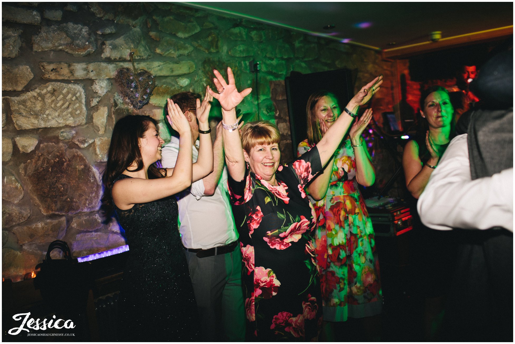 guests dance with their hands in the air