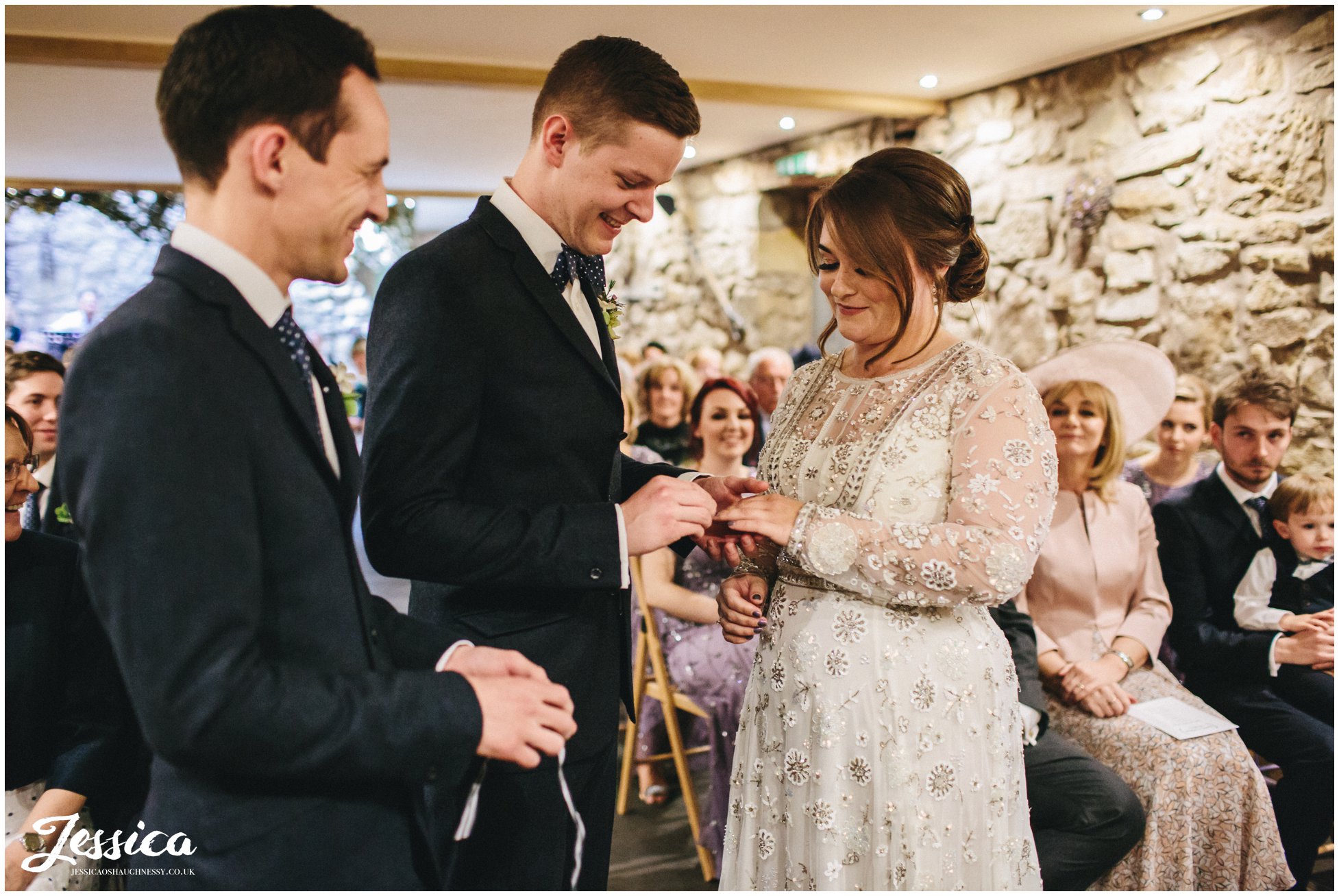 couple exchange rings during their ceremony in north wales