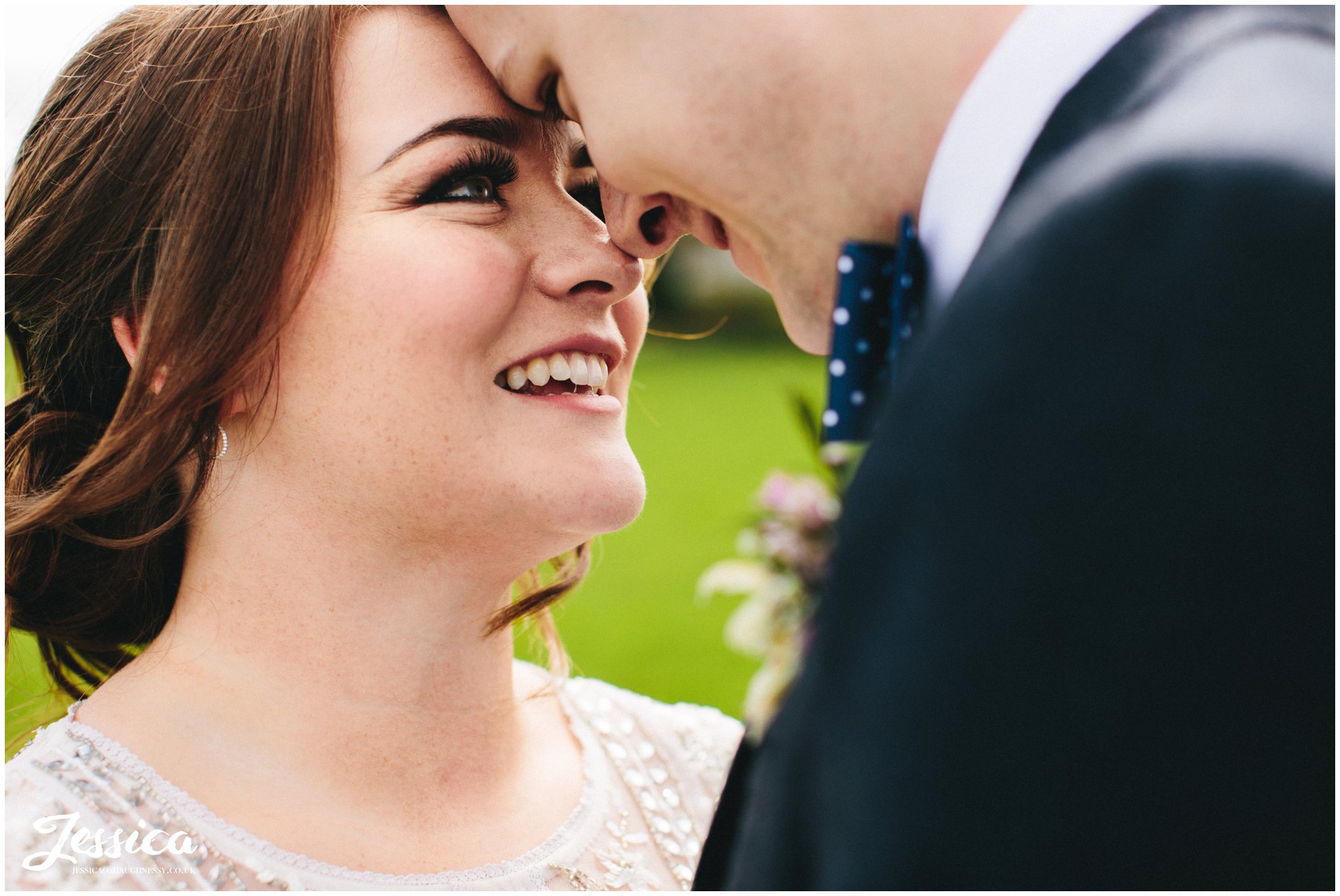 close up on bride smiling at her groom at tower hill barns