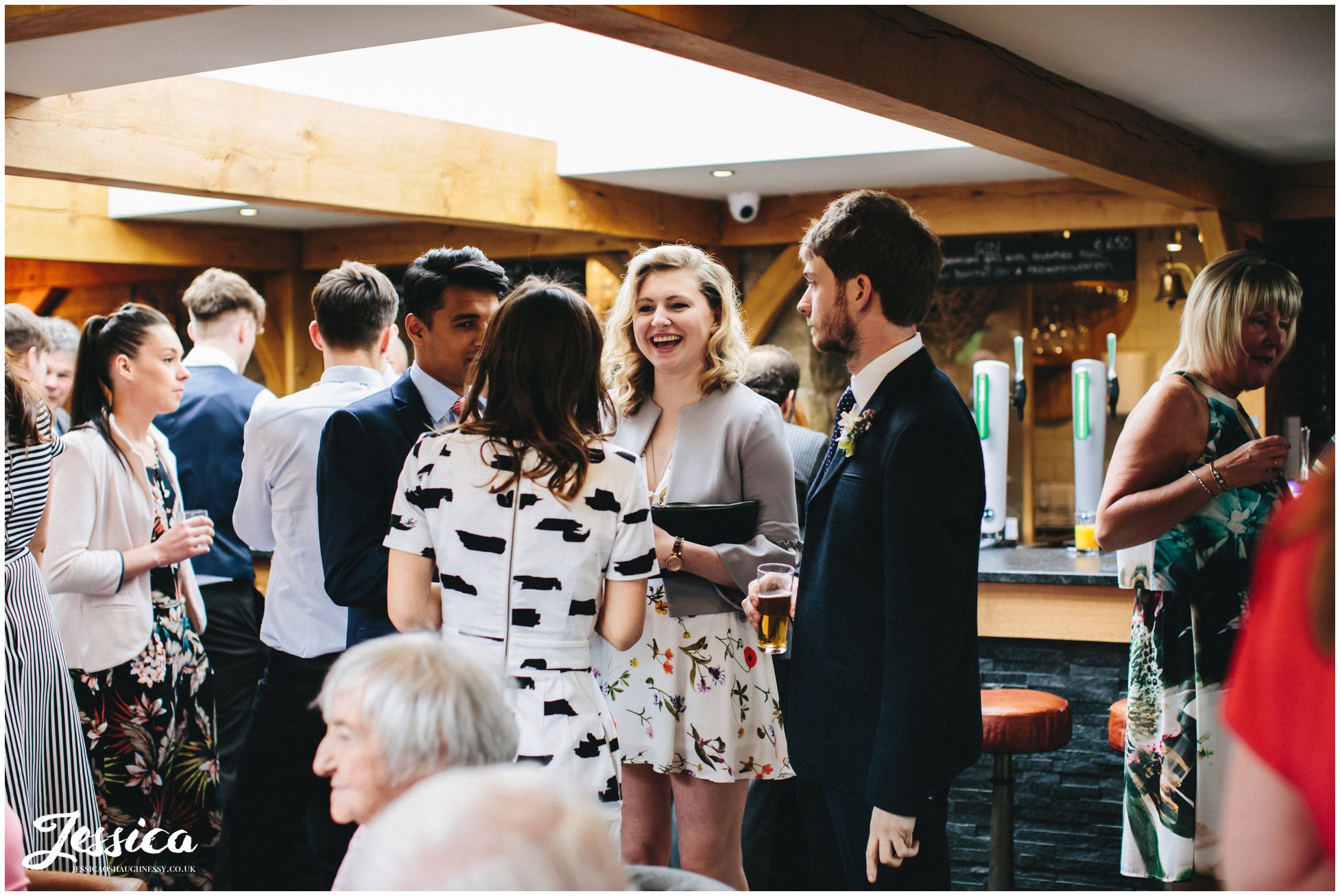 guests laughing during the wedding reception