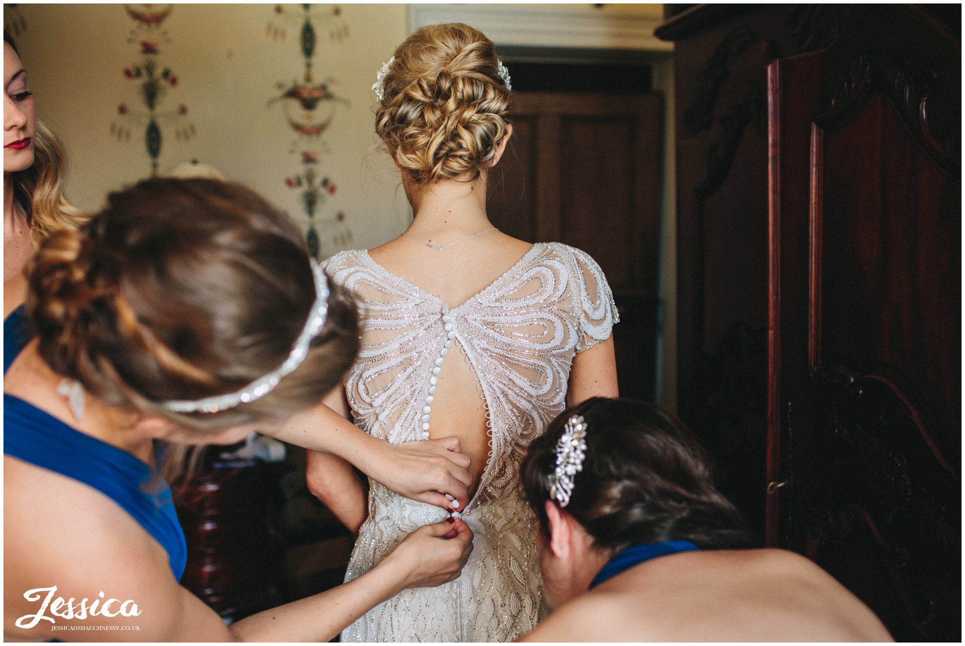 bridesmaids button the brides wedding dress in north wales