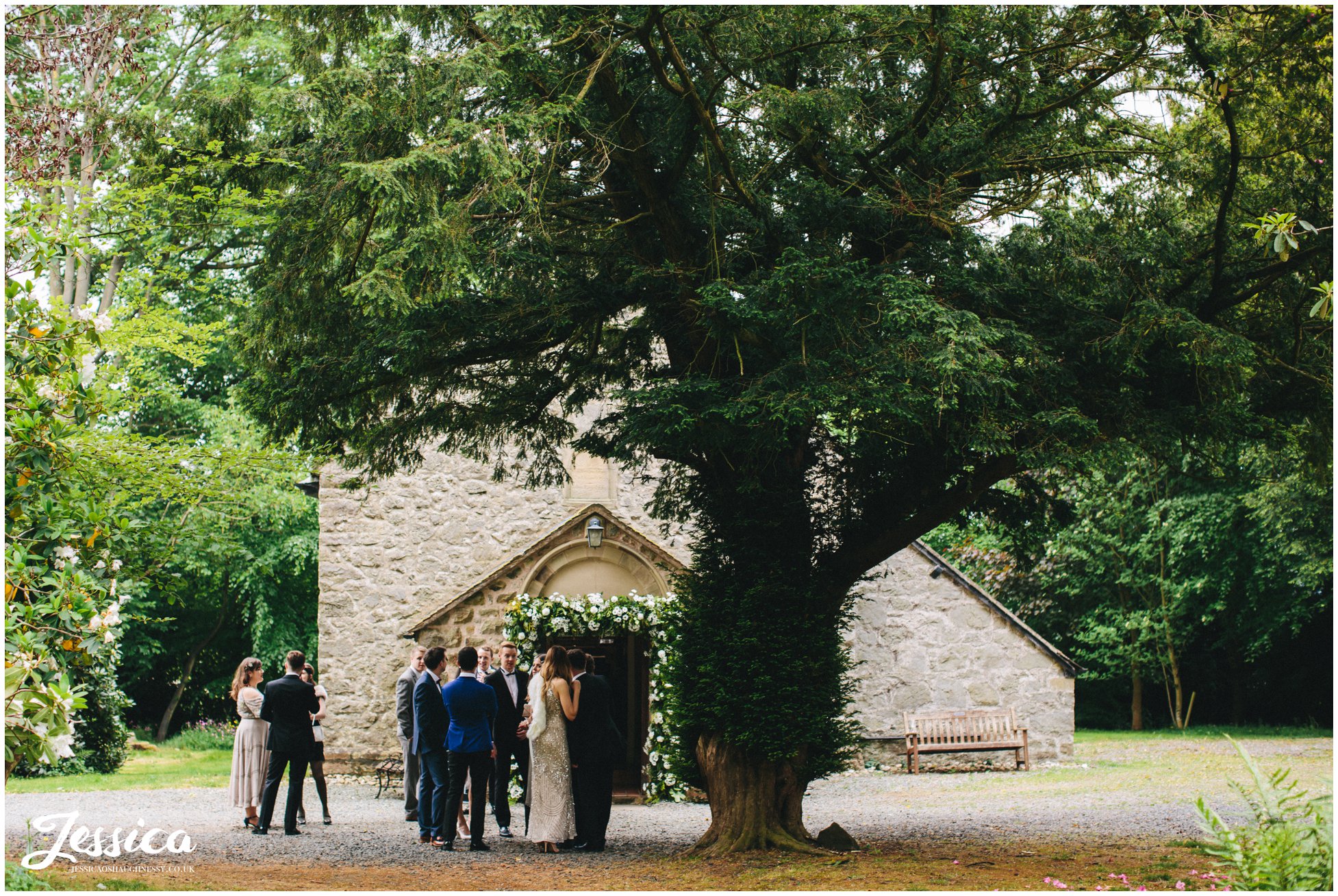 guests gather outside trevor hall's church