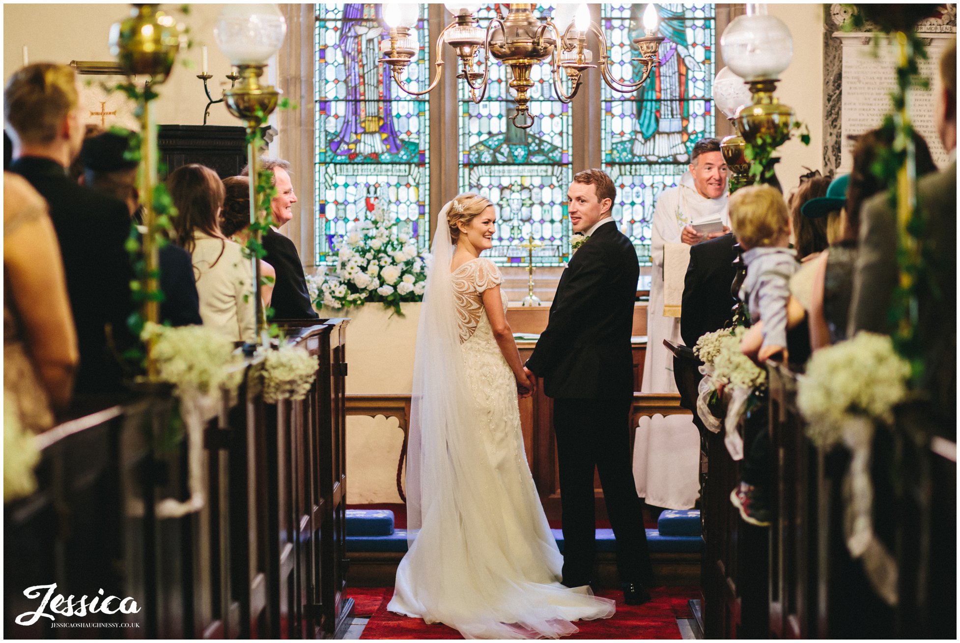Bride & Groom during their wedding ceremony at Trevor Church