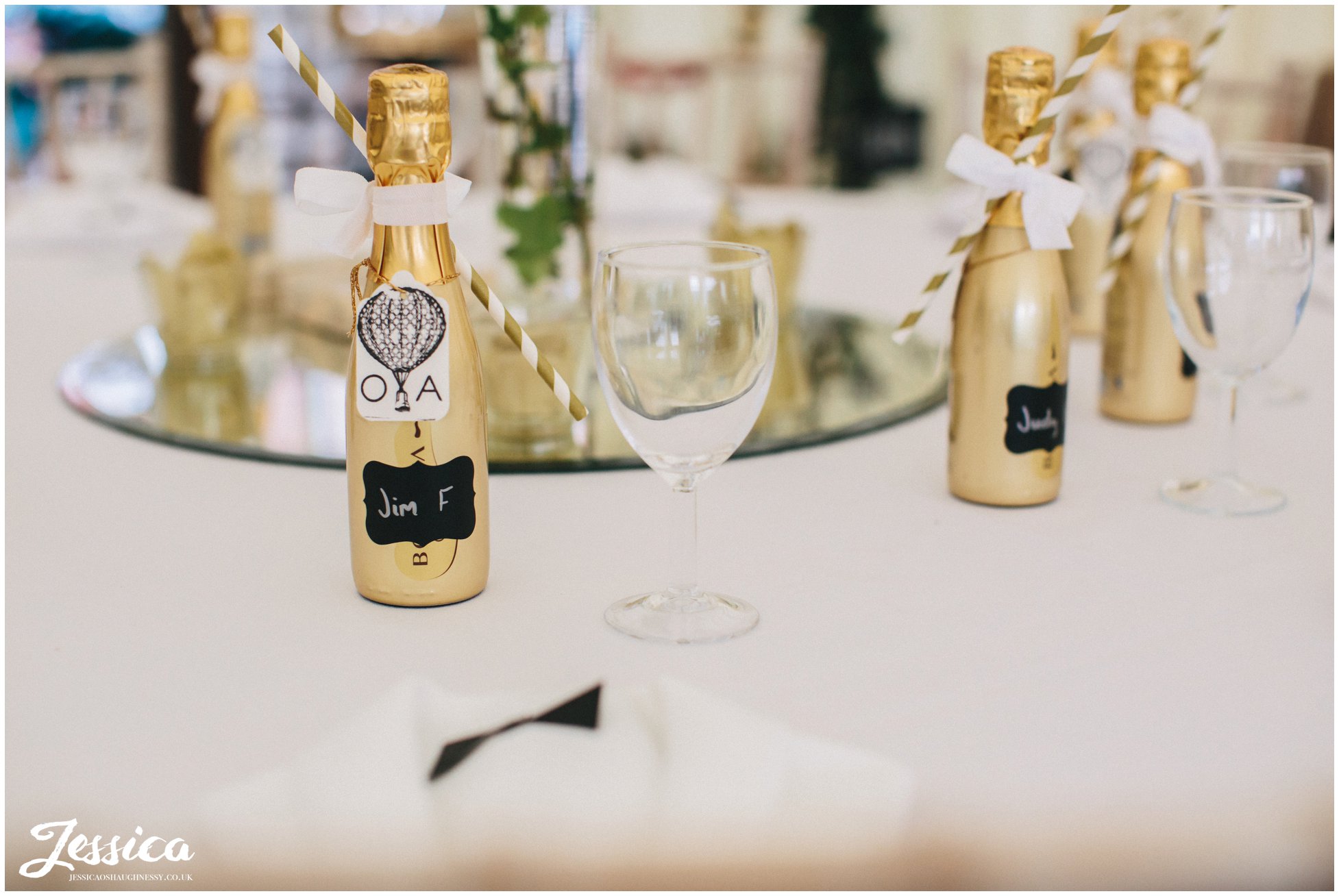 champagne favours decorate the tables at a wedding at trevor hall in north wales
