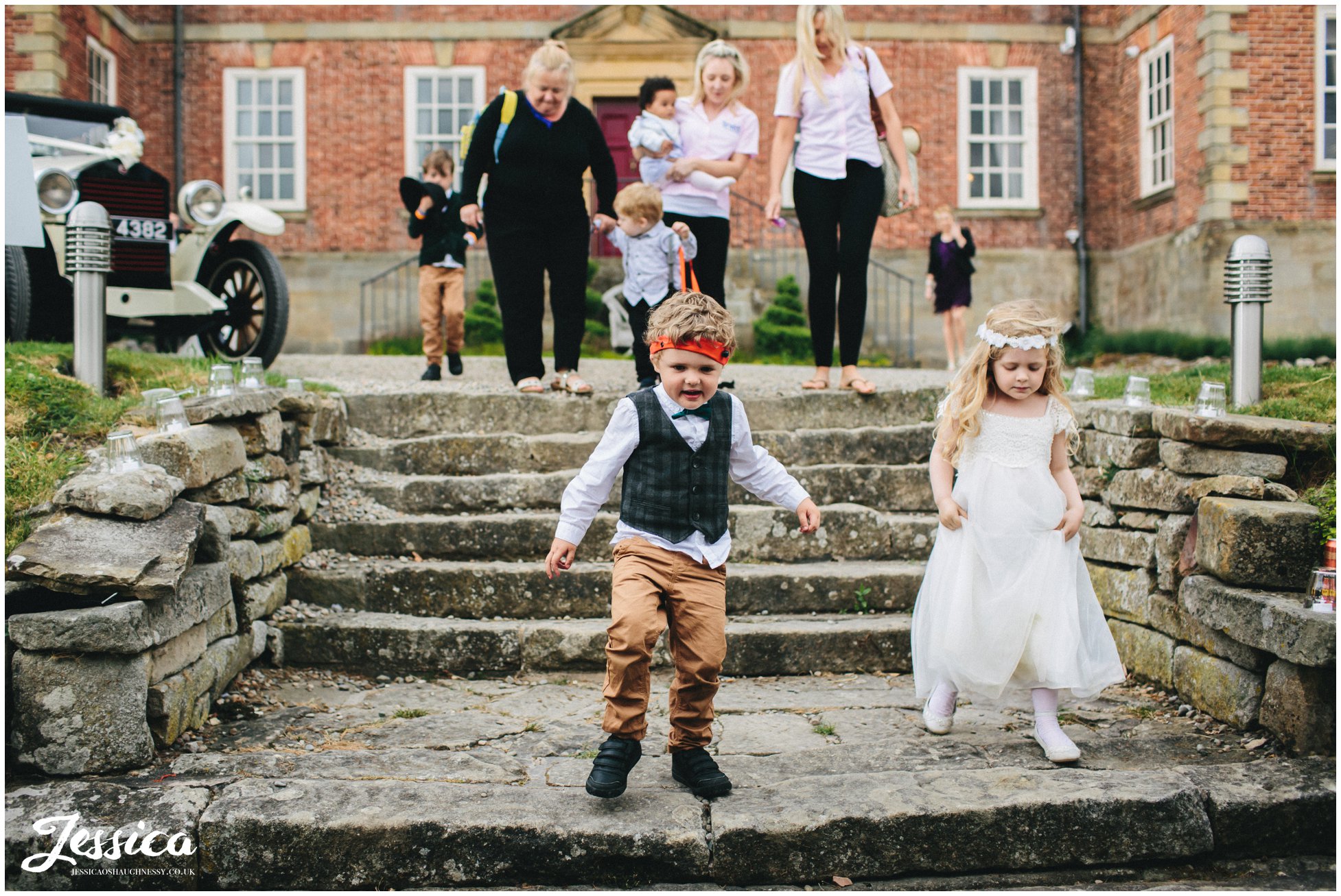 children playing on the steps during the trevor hall wedding