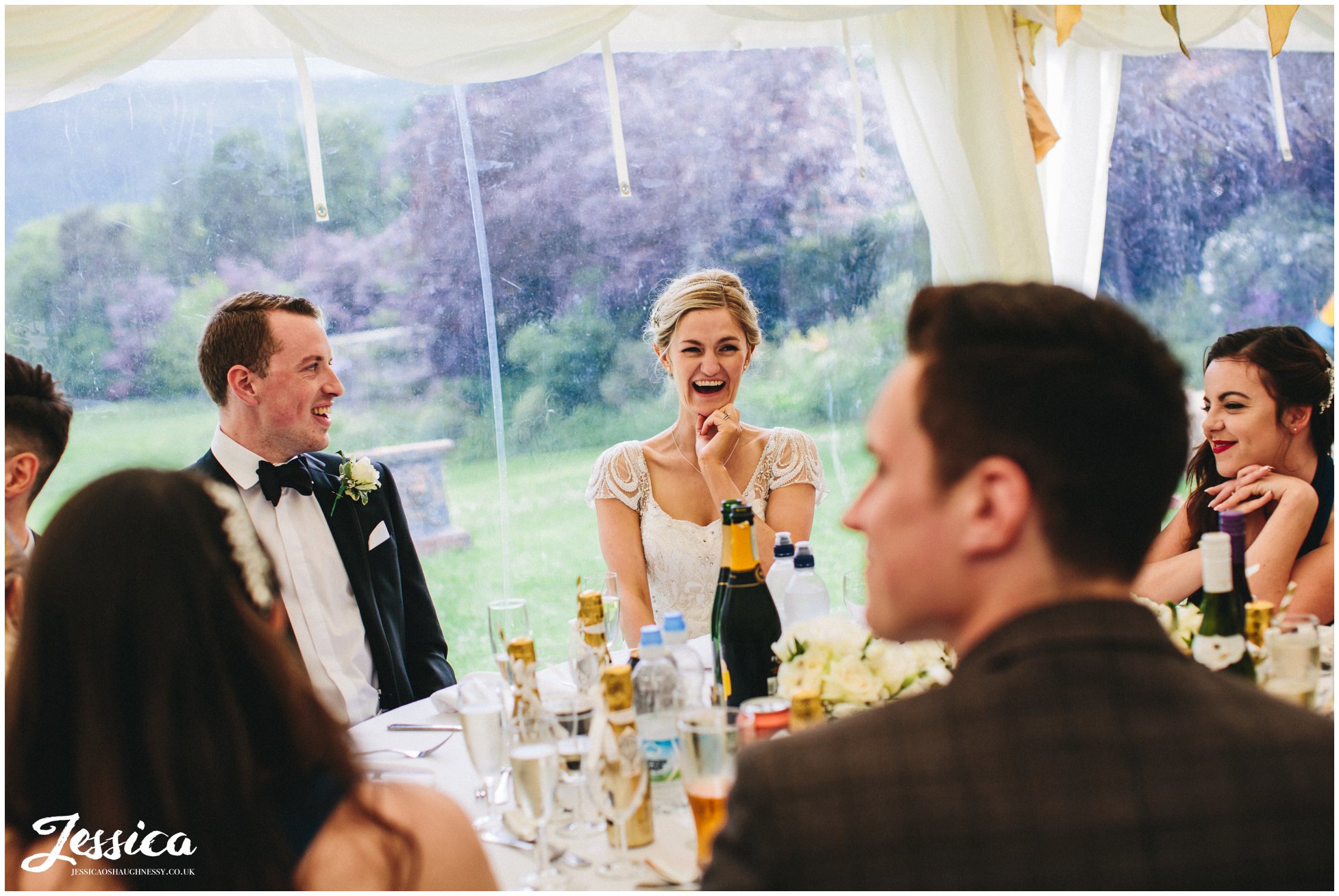 north wales wedding photographer - bride laughing during the speeches