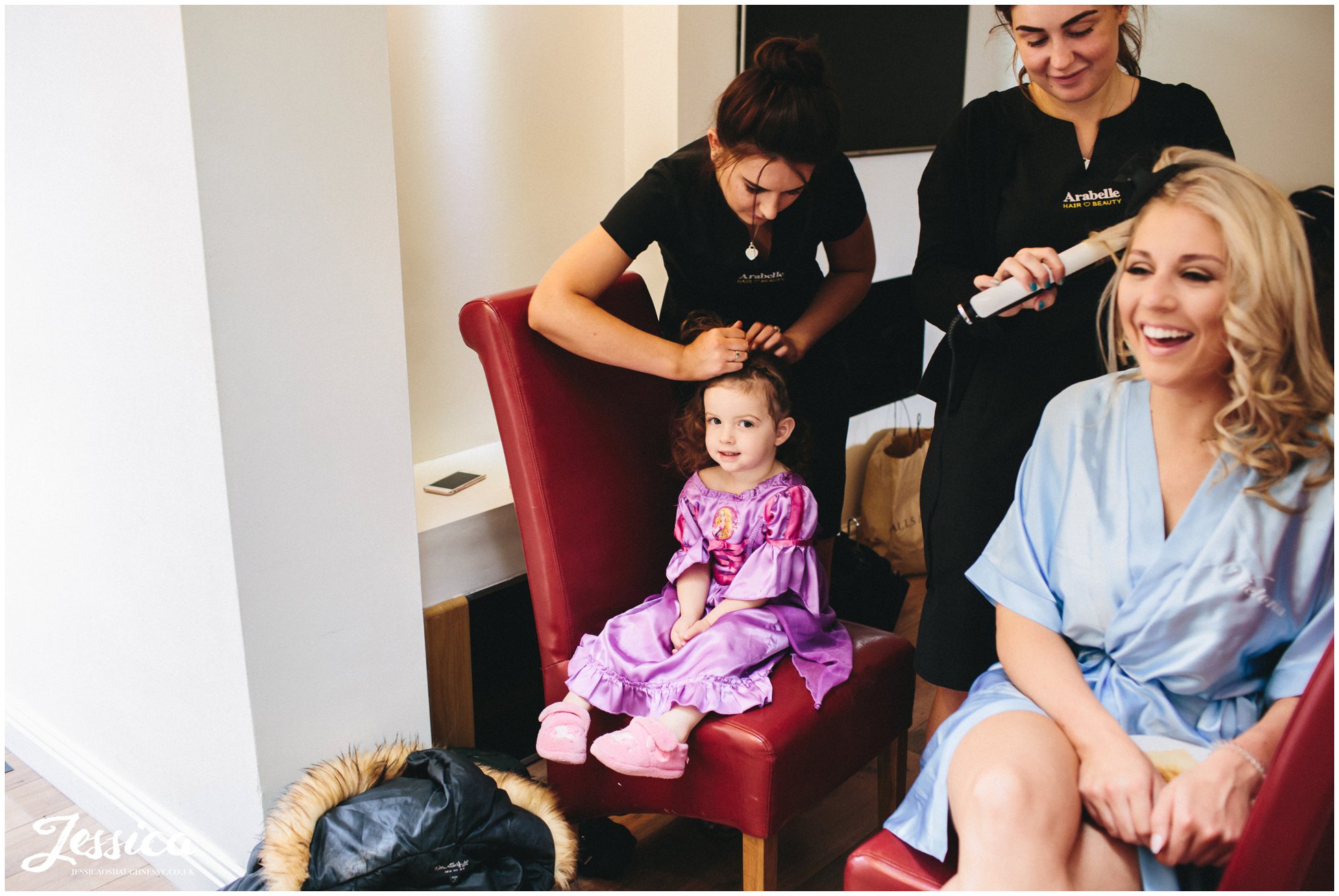 flower girl getting her hair done ready for the wedding at thornton manor