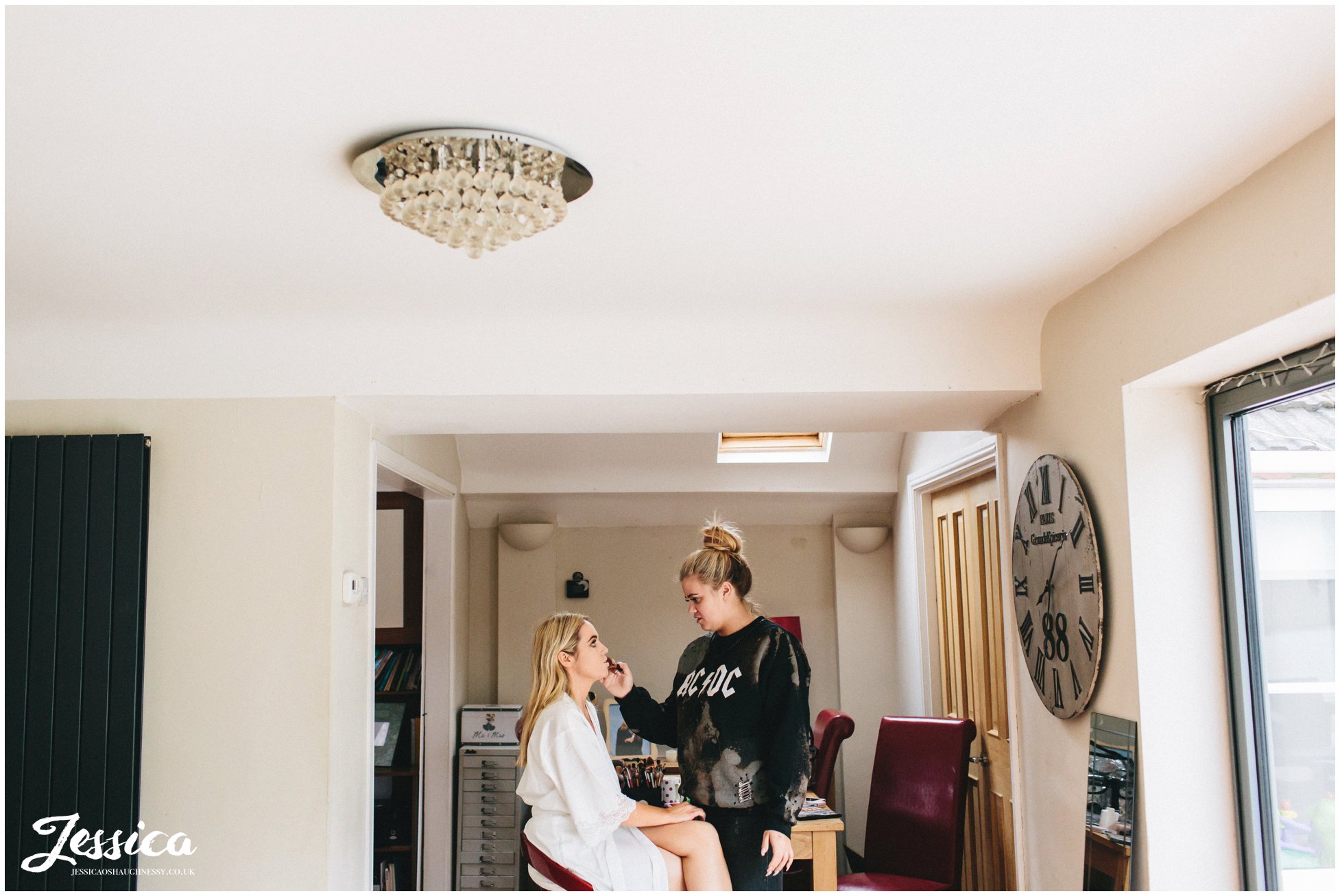 bride gets her make-up done on the morning of her wirral wedding