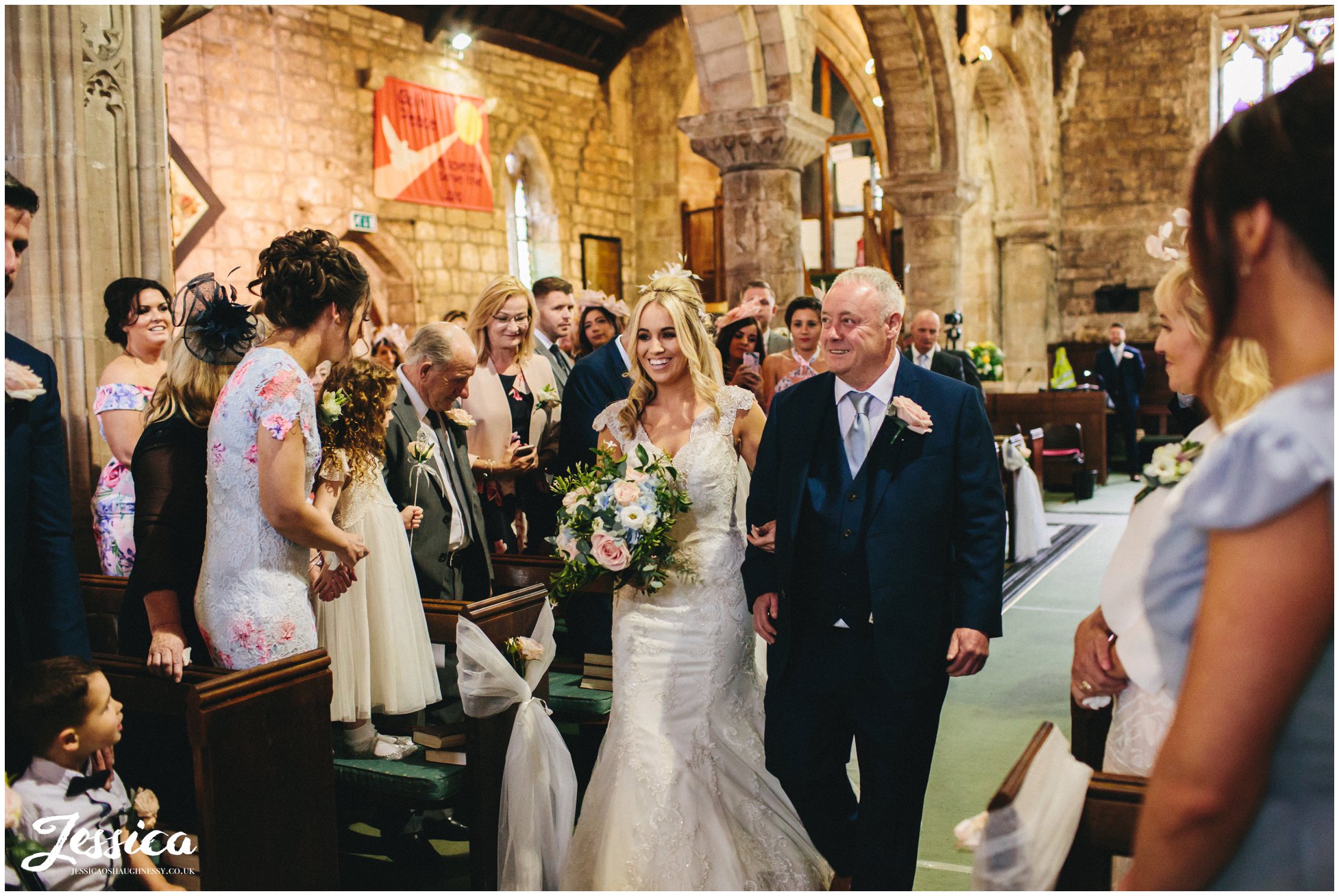 bride & father walk down the aisle for their wirral wedding ceremony