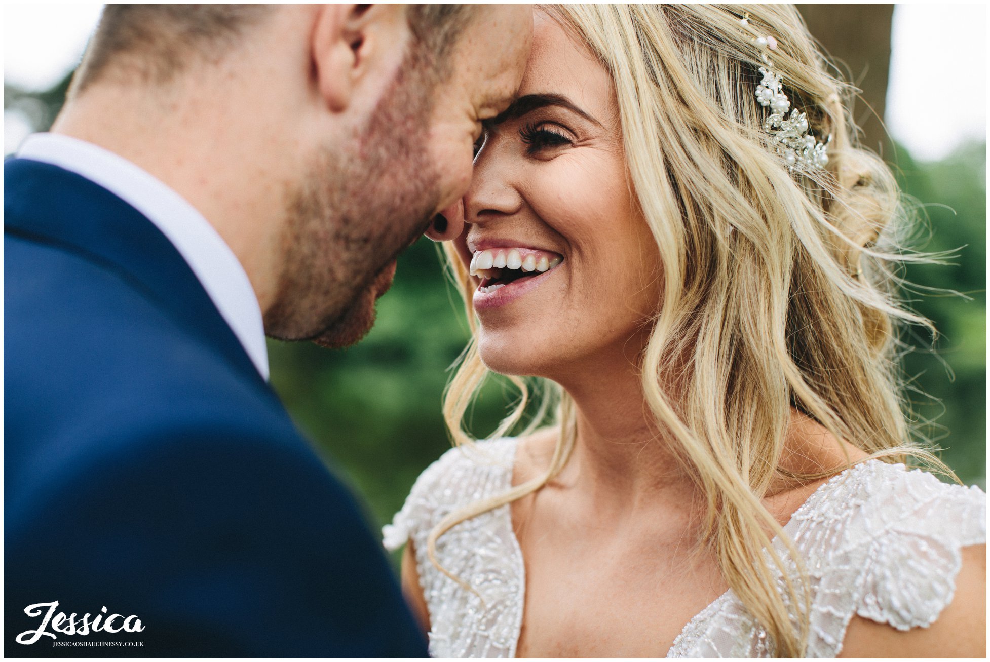 close up of bride laughing on their thornton manor wedding day