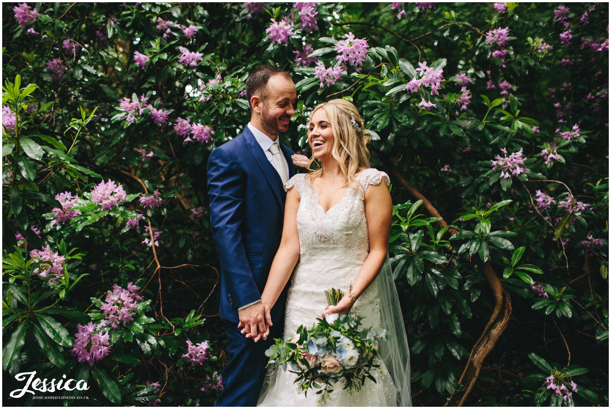 newly wed's amongst purple flowers - lakeside marquee, thornton manor 