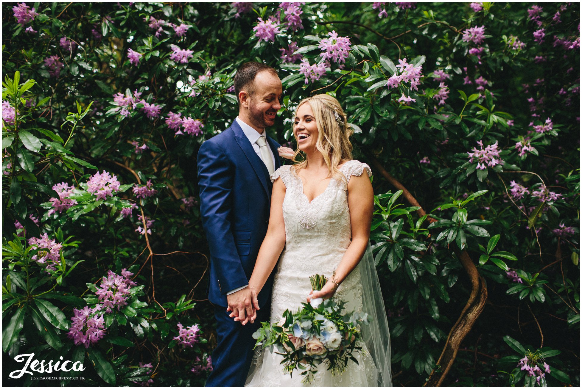 newly wed's amongst purple flowers - lakeside marquee, thornton manor