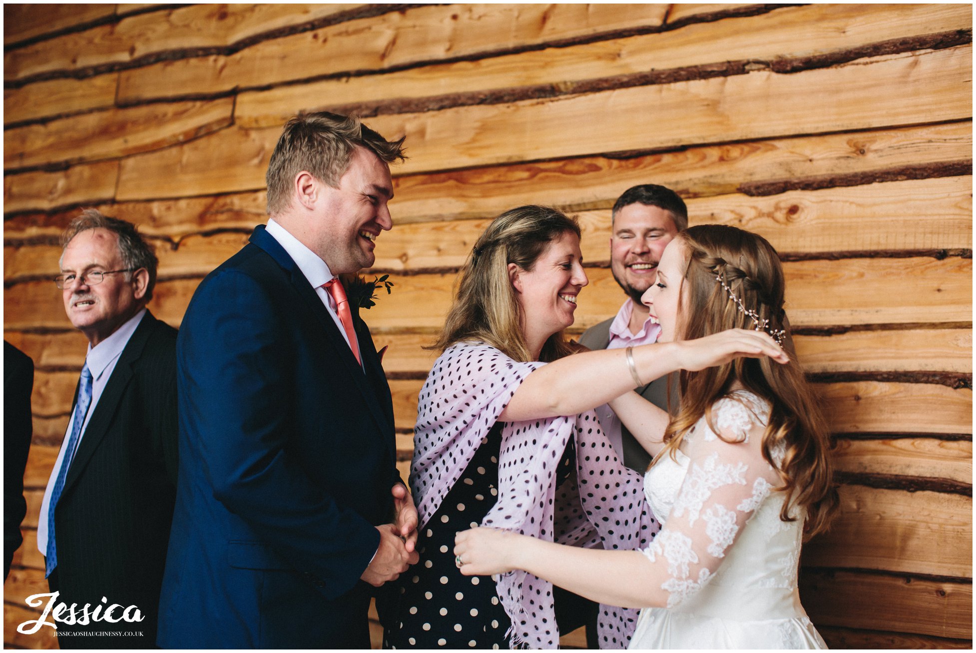 guests hug newly wed's after their north wales wedding ceremony