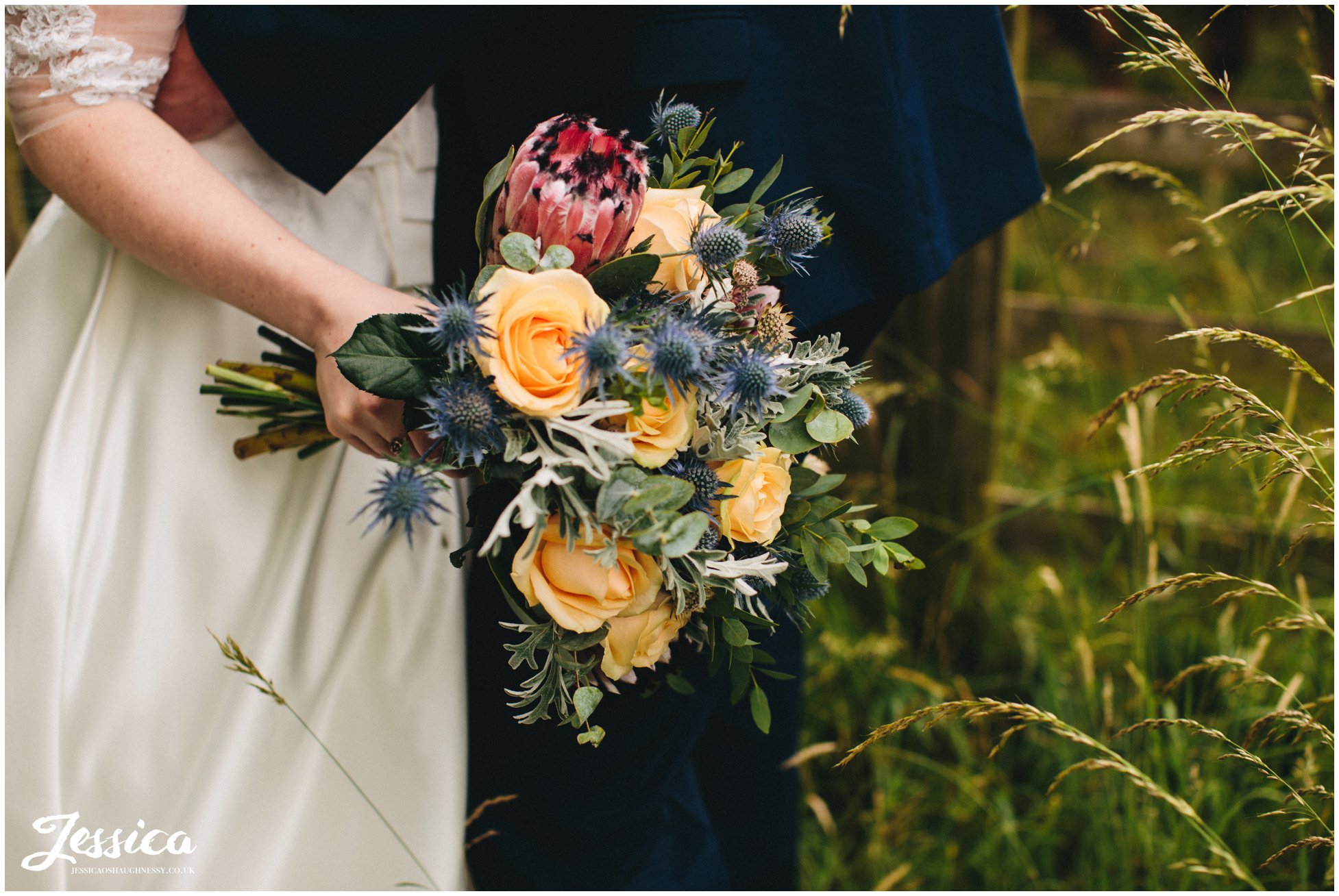 close up of bride holding her flowers at their tower hill barns wedding in trevor, wrexham