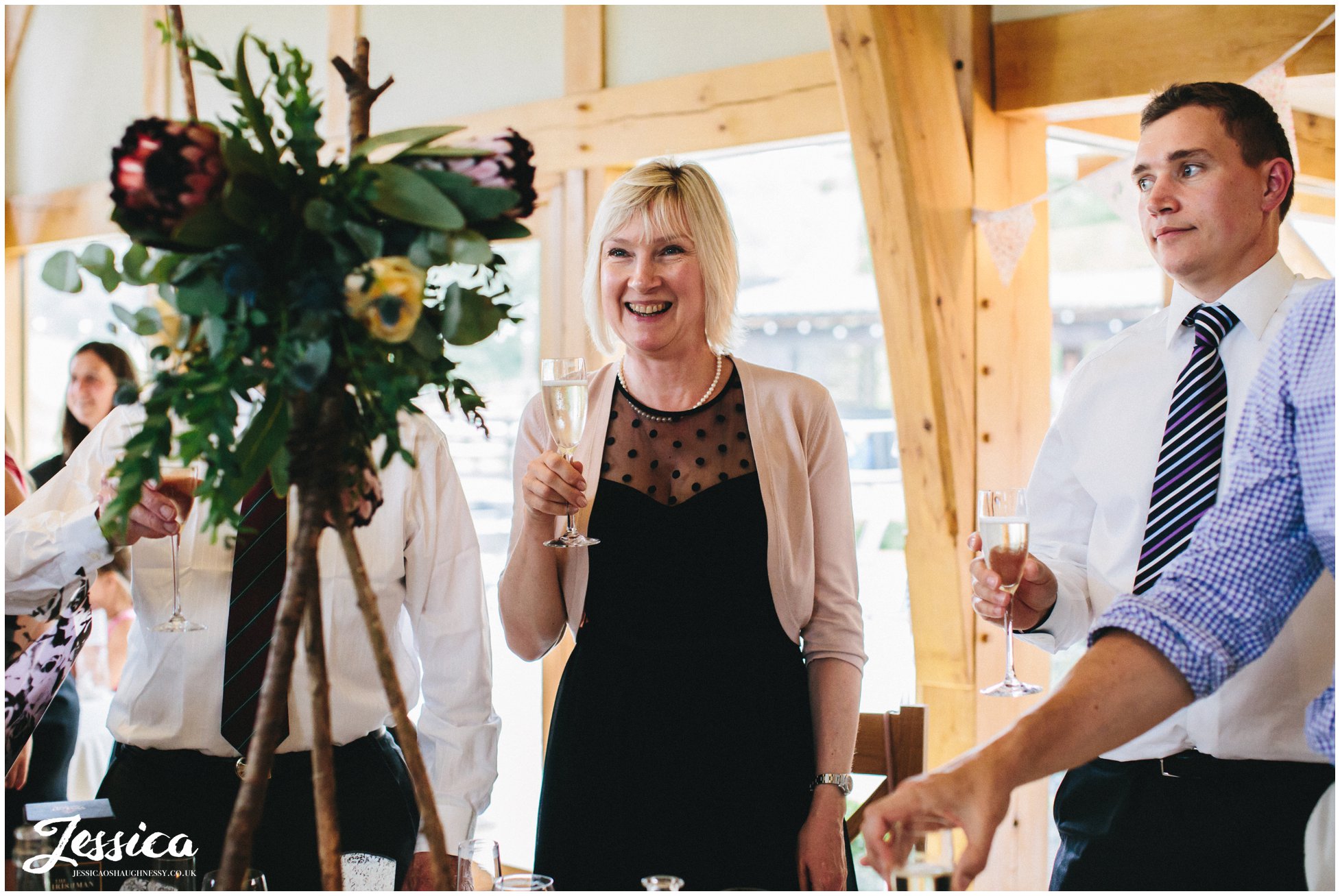 guests toast the newly weds on their north wales wedding day