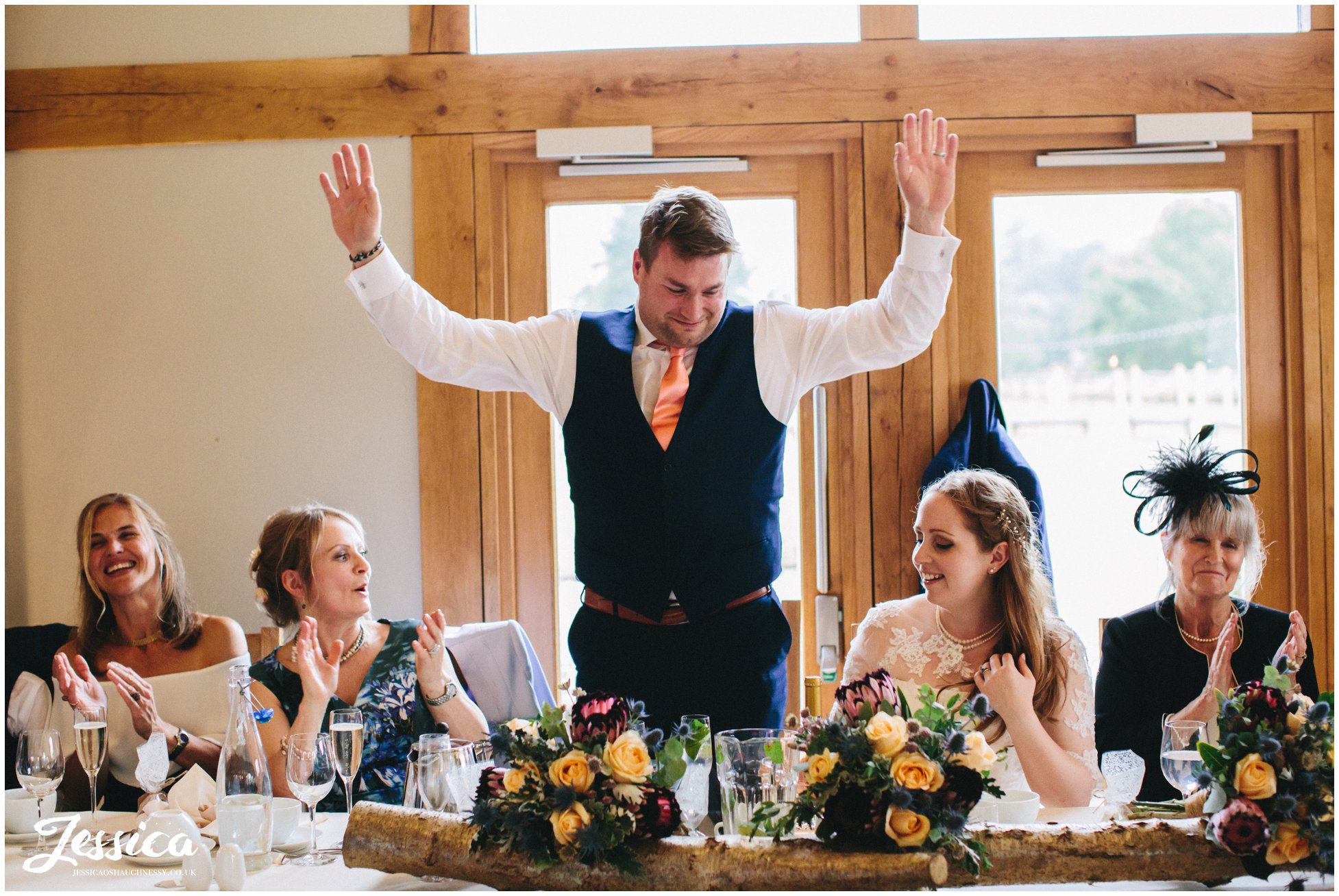 groom plays to crowd during his speech
