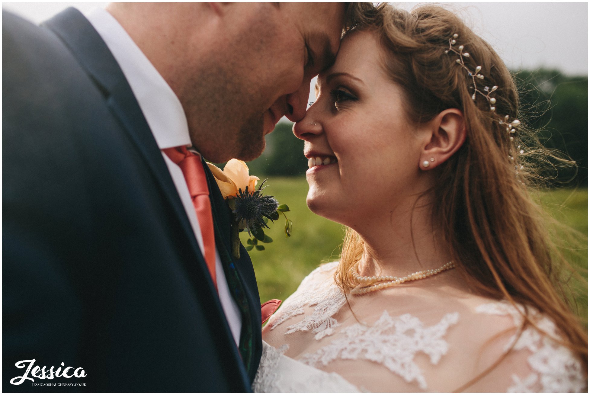 close up of brie & groom taken in the rain