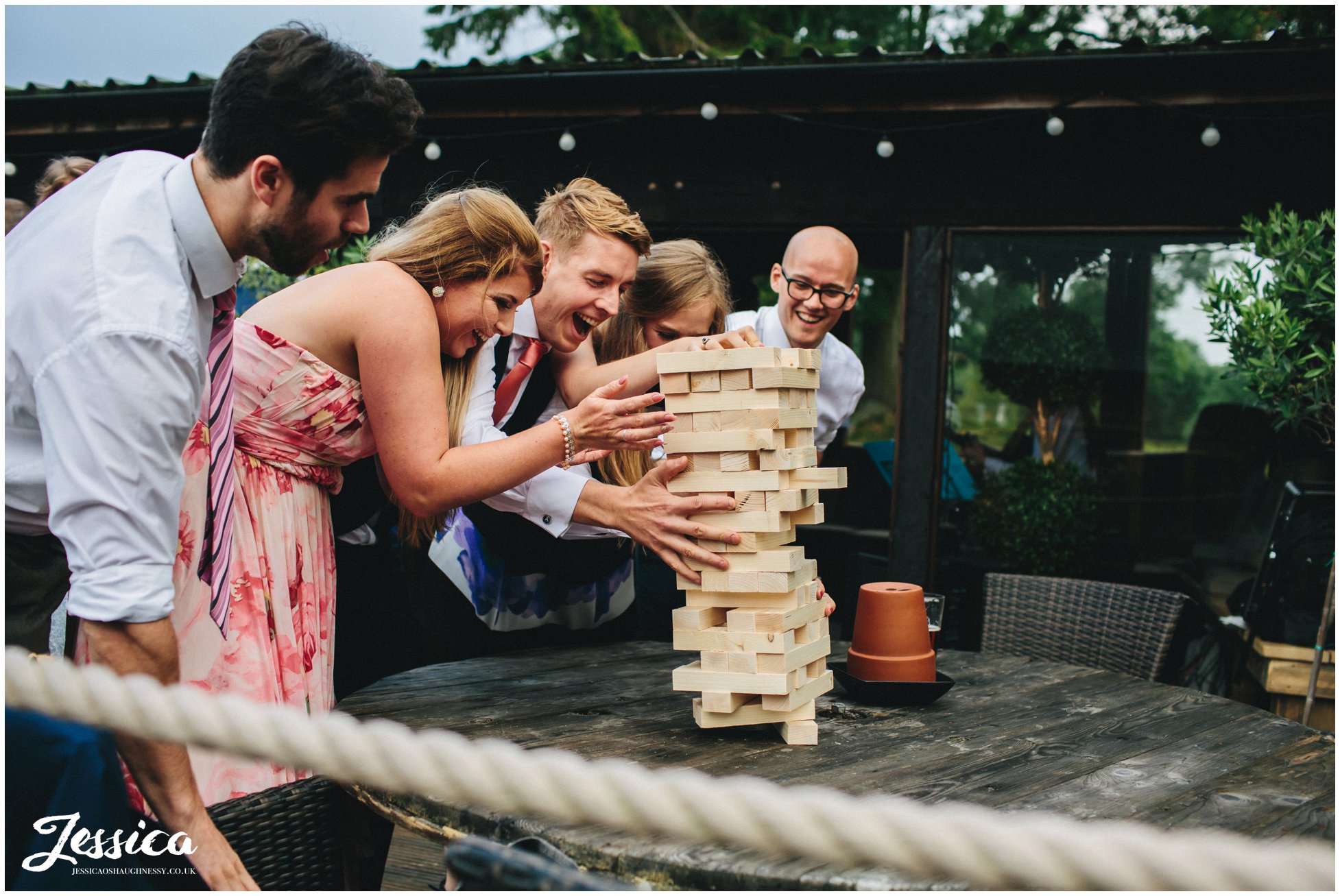 guests play jenga during a wedding in north wales