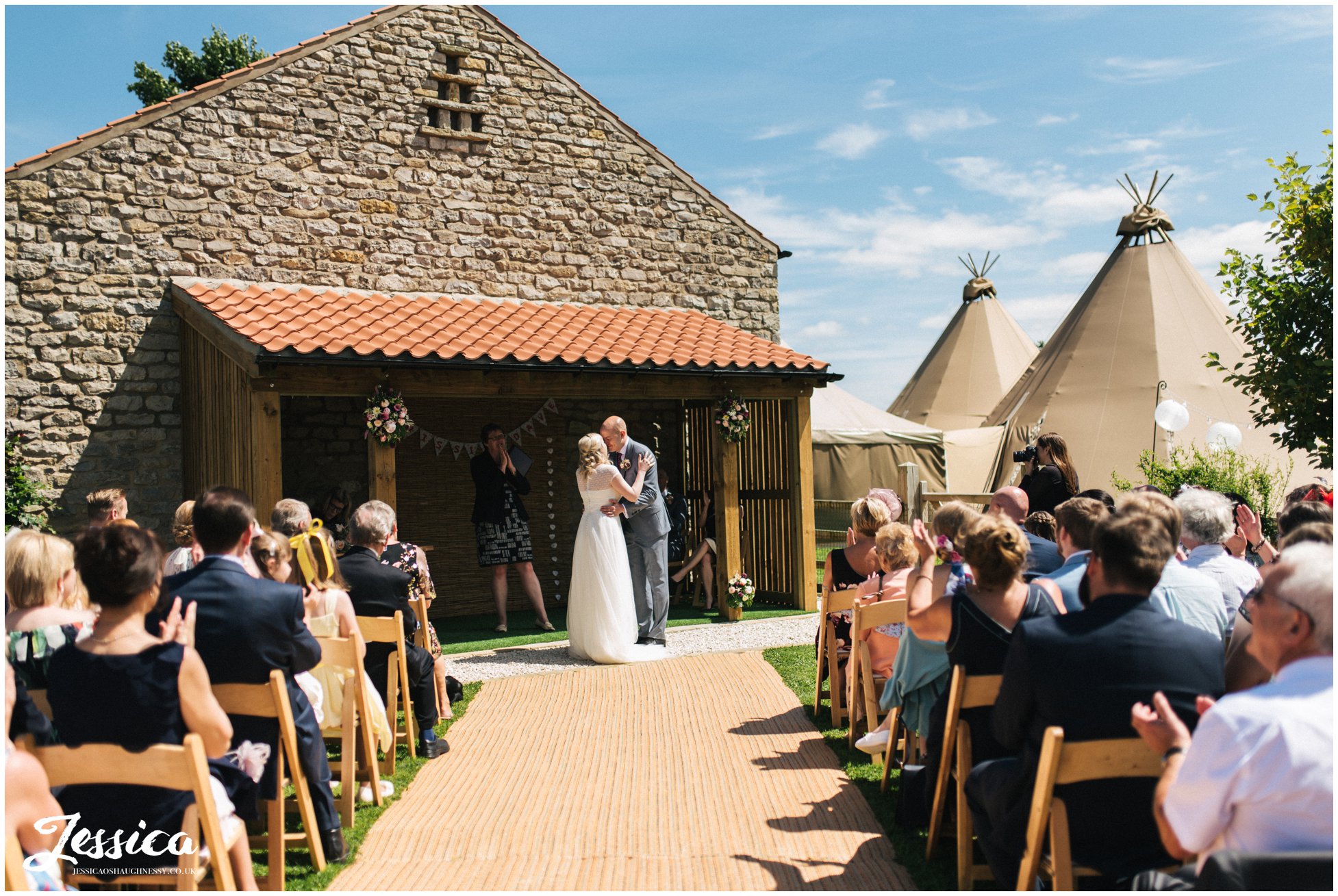 newly wed's share their first kiss - yorkshire wedding photography