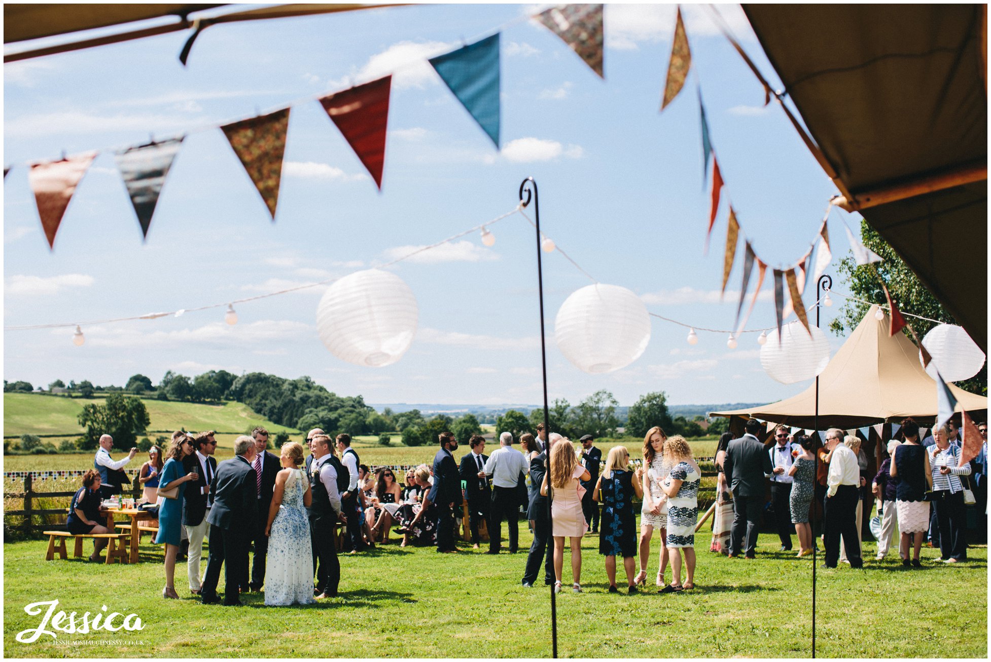 guests enjoy the sunshine at a sunny yorkshire wedding