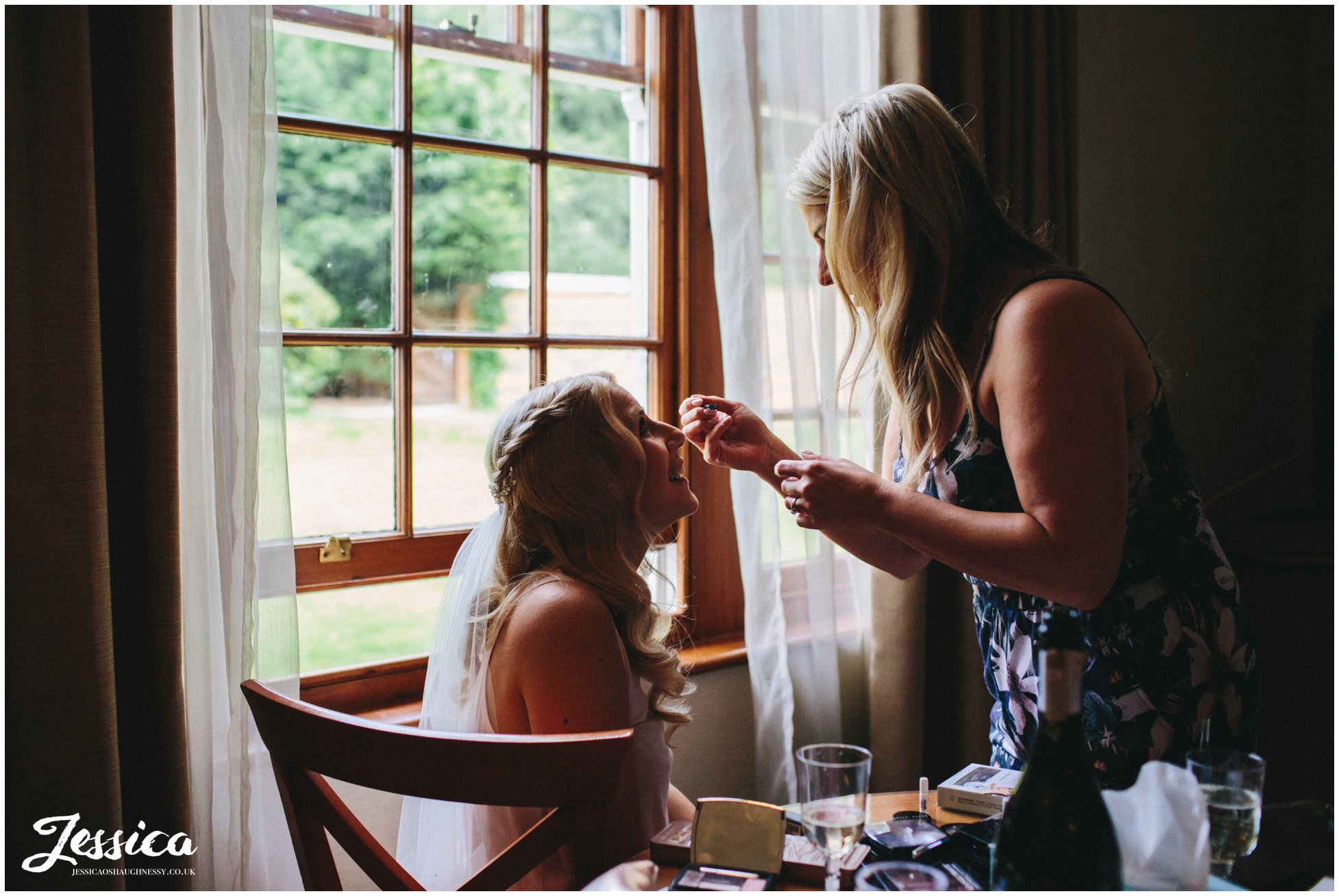 nunsmere hall in cheshire - bride gets makeup done