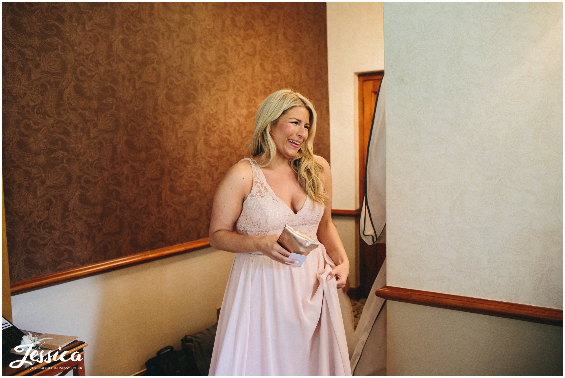bridesmaid sees bride for the first time in her wedding dress