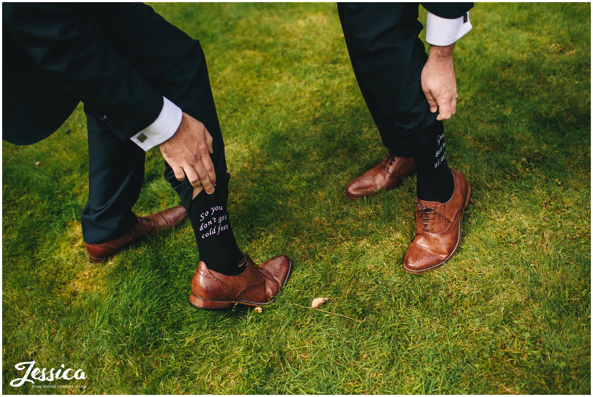 groom shows guest 'so you don't get cold feet' socks