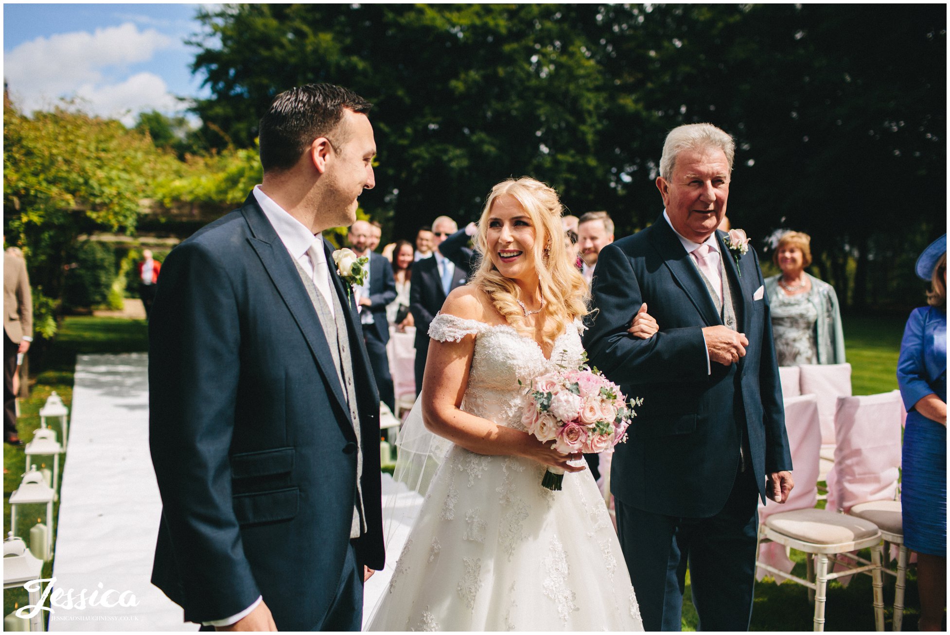 bride sees groom for the first time at a wedding in cheshire