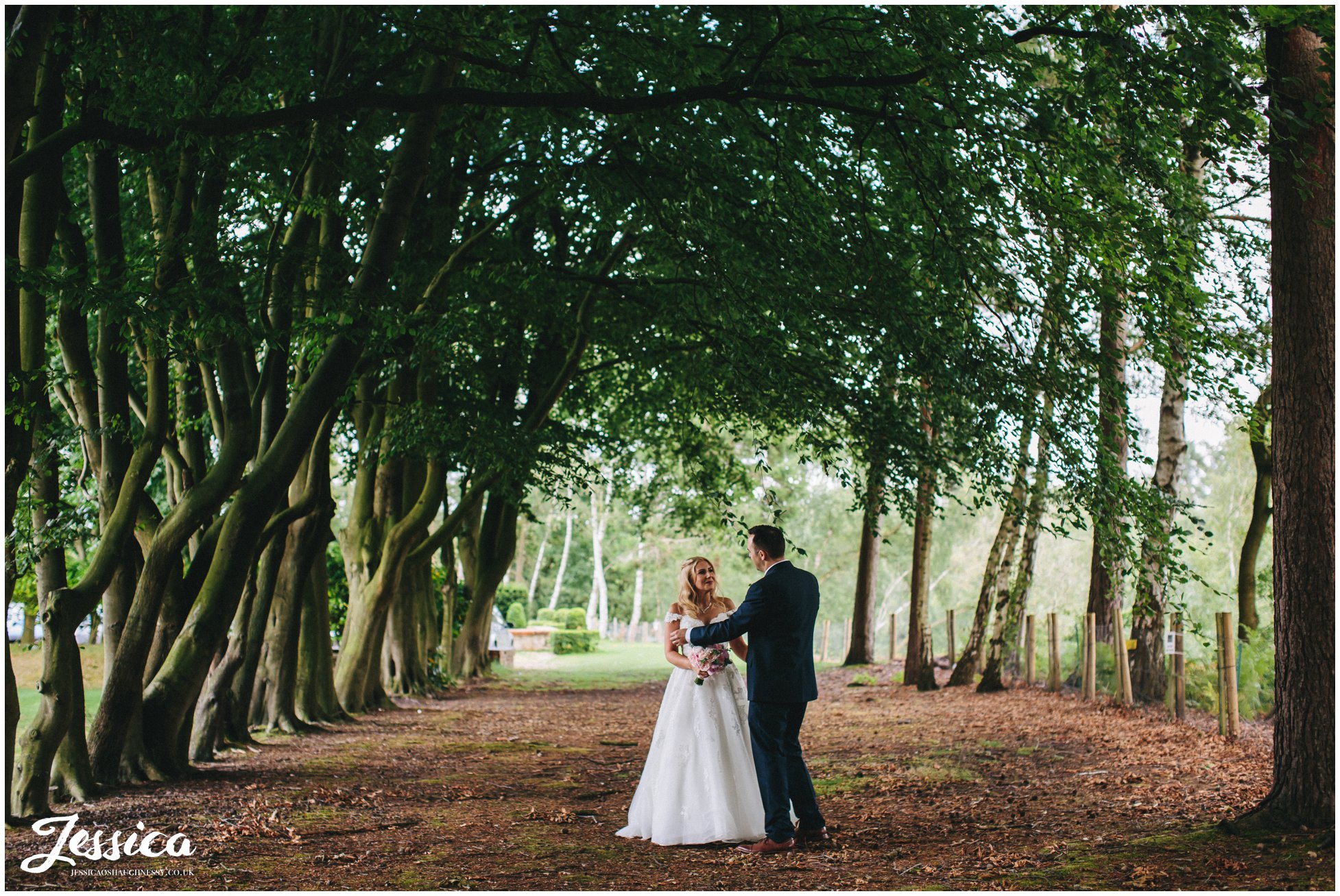 bride & groom stood in the forest at nunsmere hall in cheshire