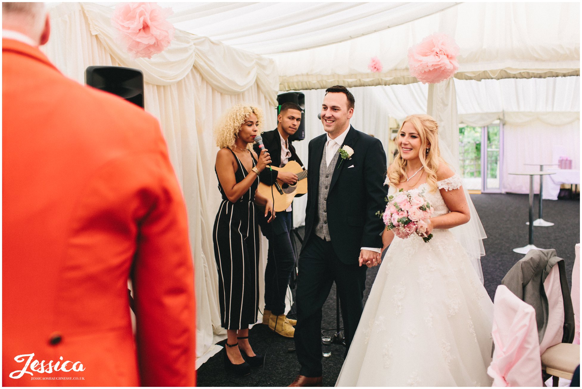 newly wed's announced into wedding breakfast at nunsmere hall