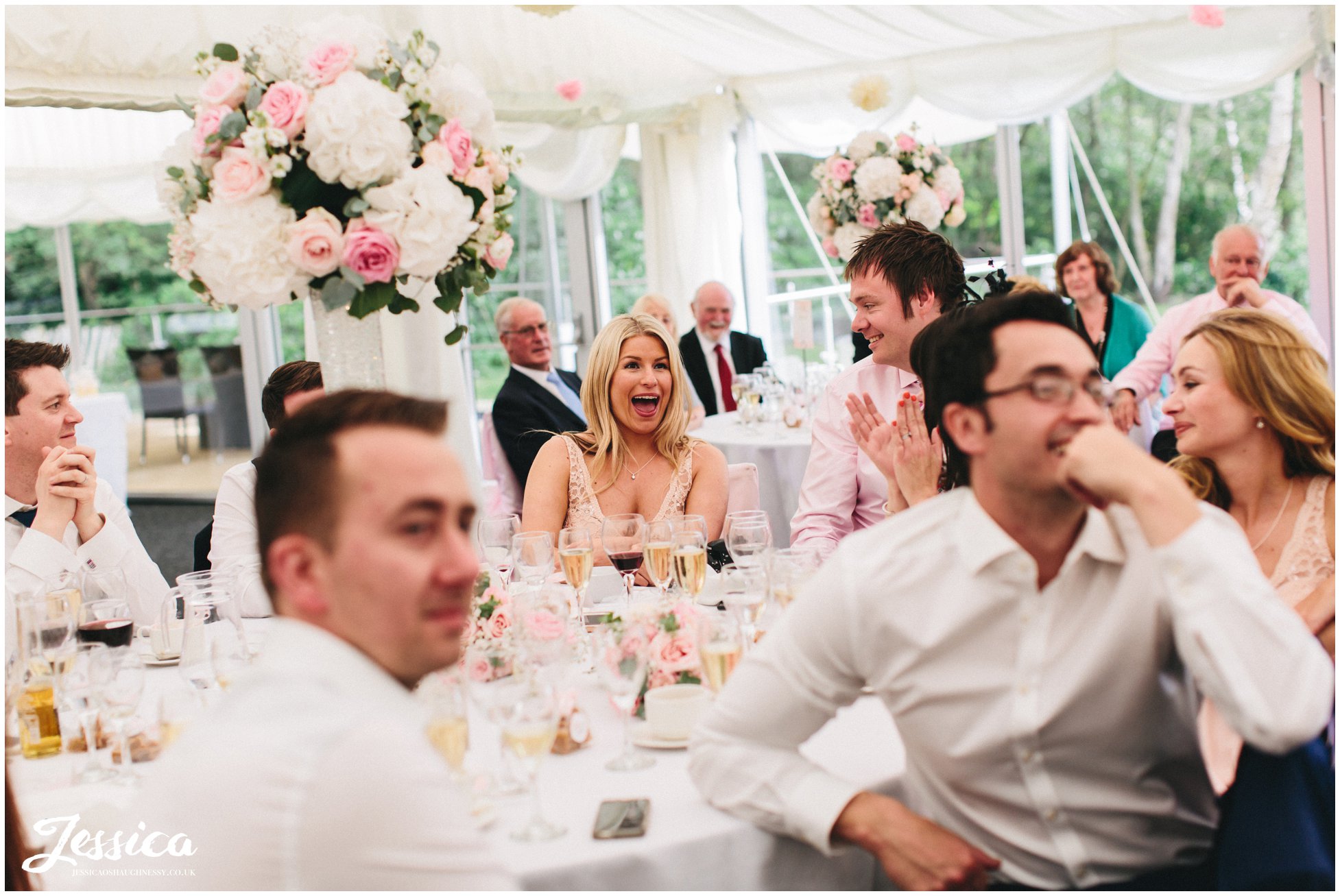 guests laughing during best mans speech in cheshire