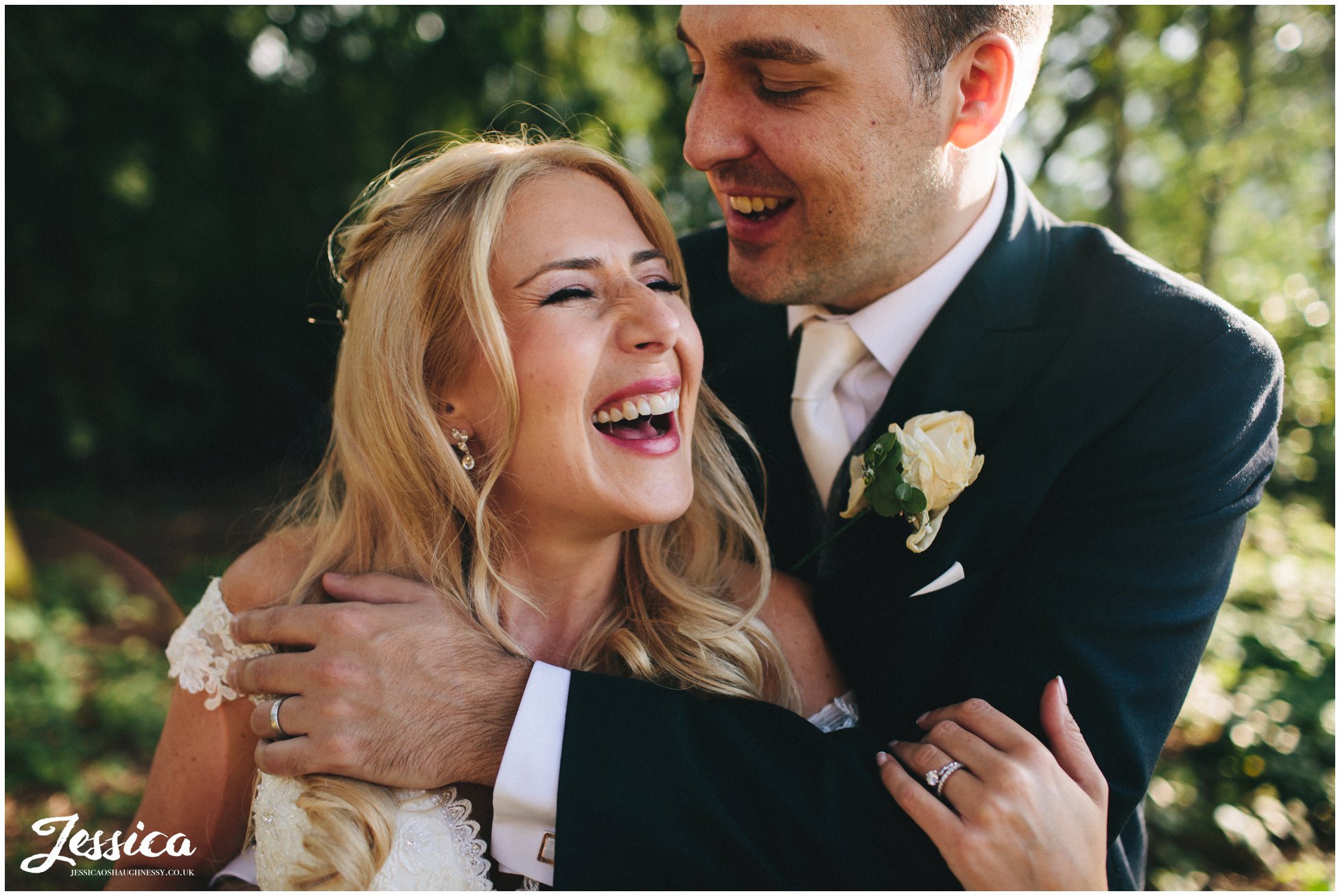 close up of bride & groom laughing - cheshire wedding photographer