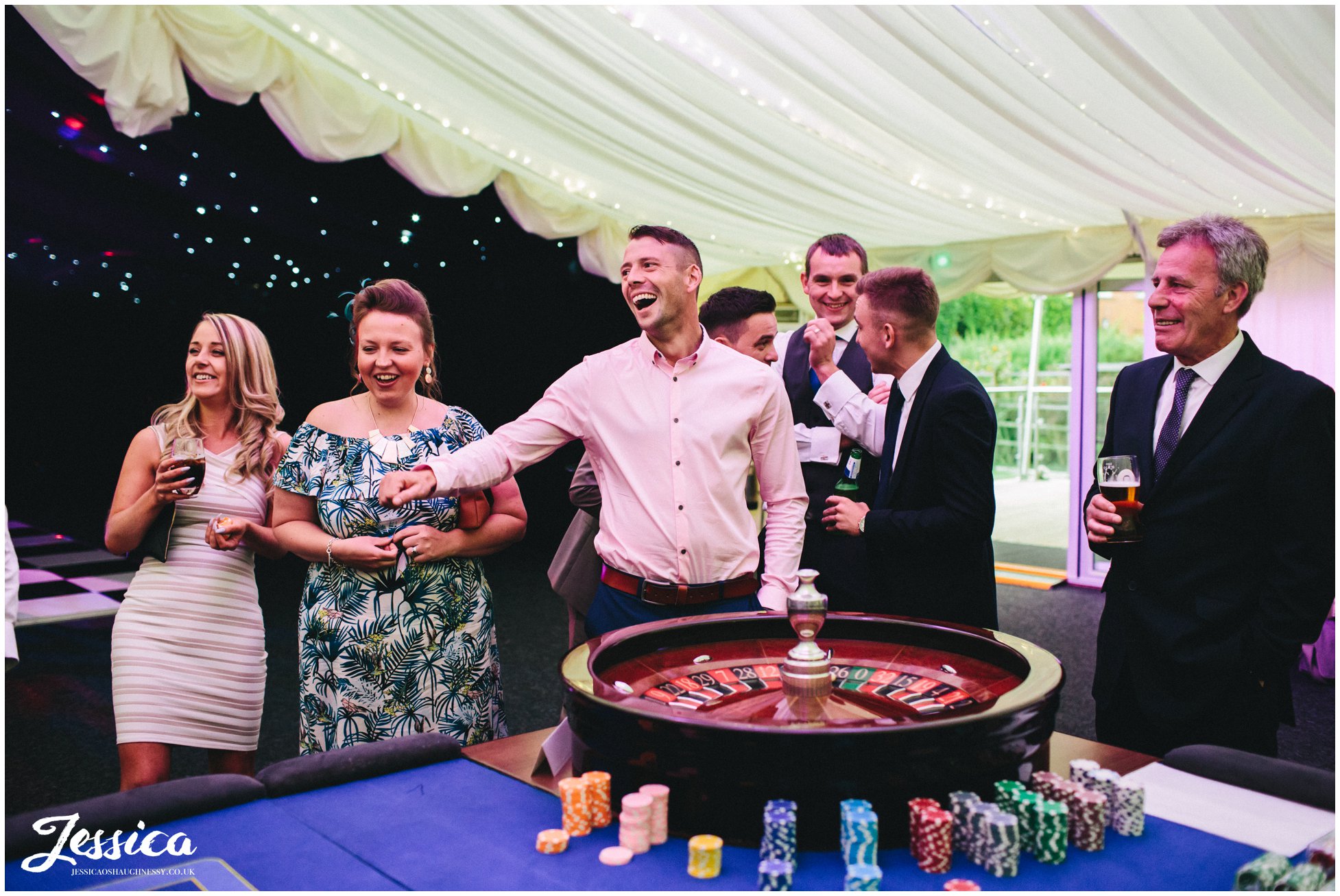 wedding guests enjoying playing on the casino