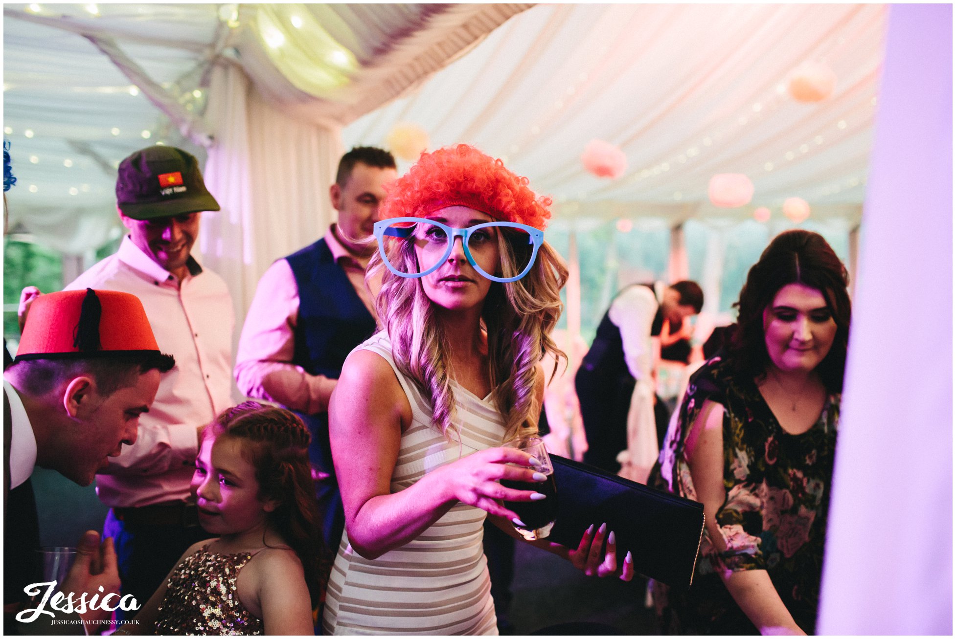 cheshire wedding photographer - wedding guest wearing comedy glasses