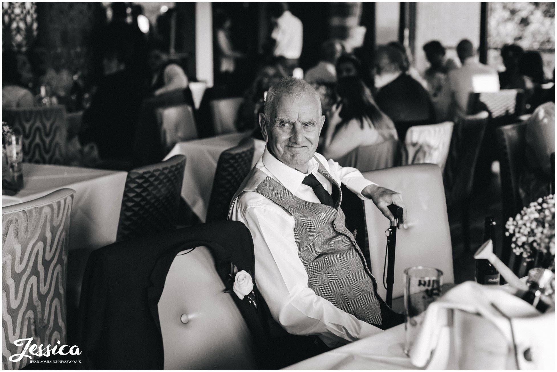 bride's grandad watching bride looking proud