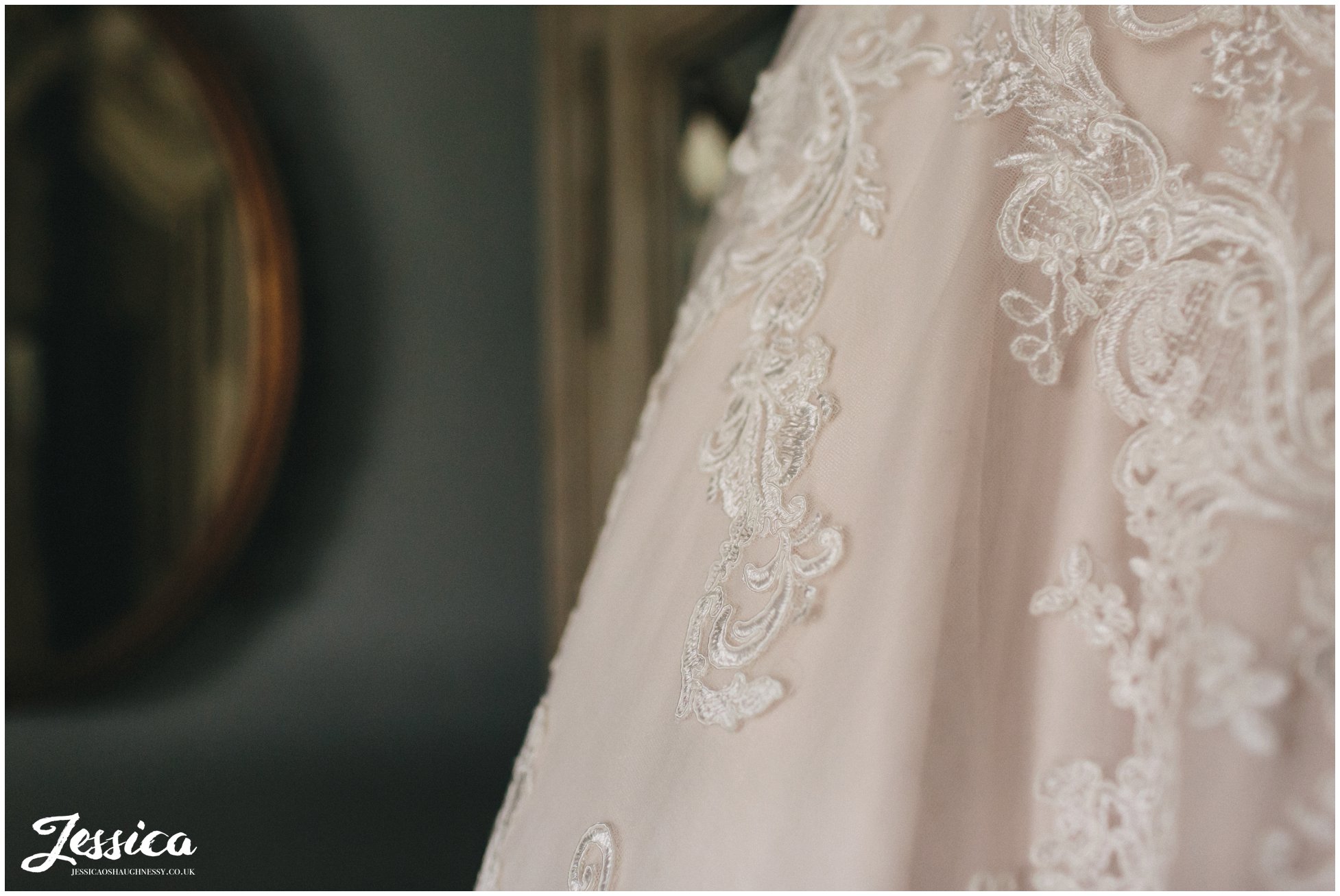 close up of lace detail on wedding dress