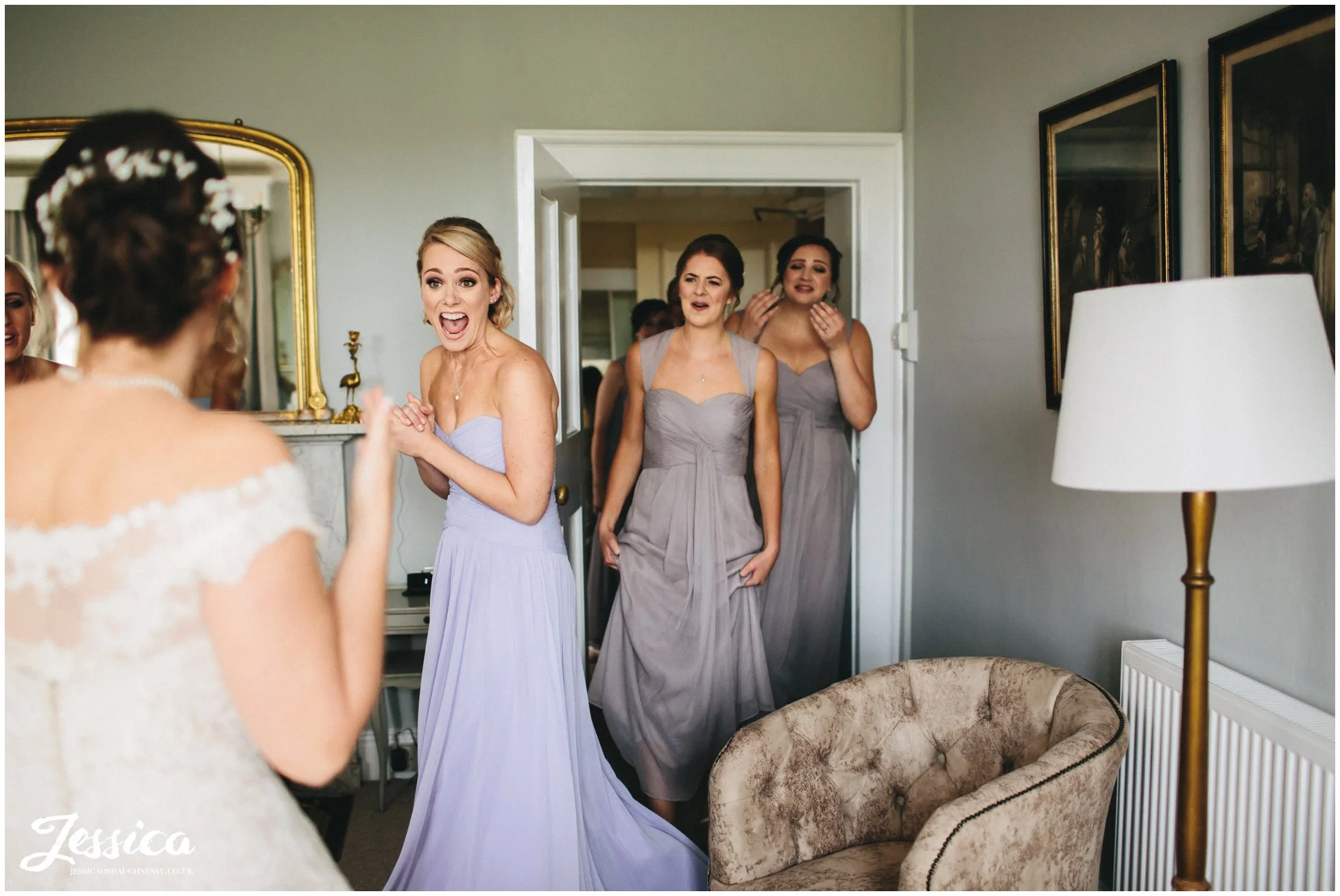 bridesmaids reaction when seeing the bride in her wedding dress