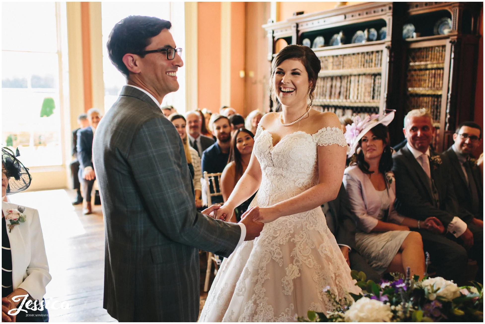 bride & groom laughing during their prestwold hall wedding ceremony