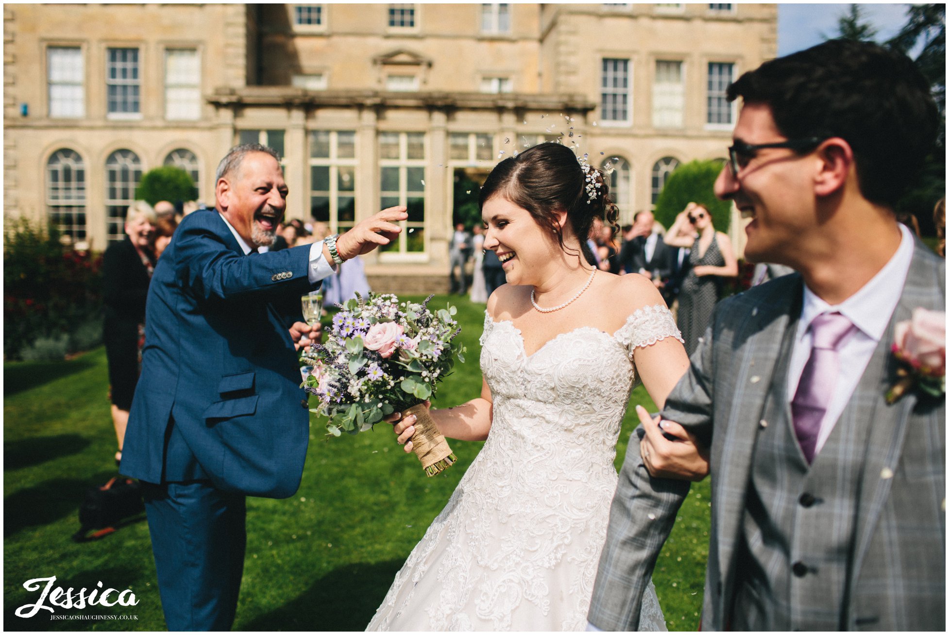 guest throws confetti in brides face