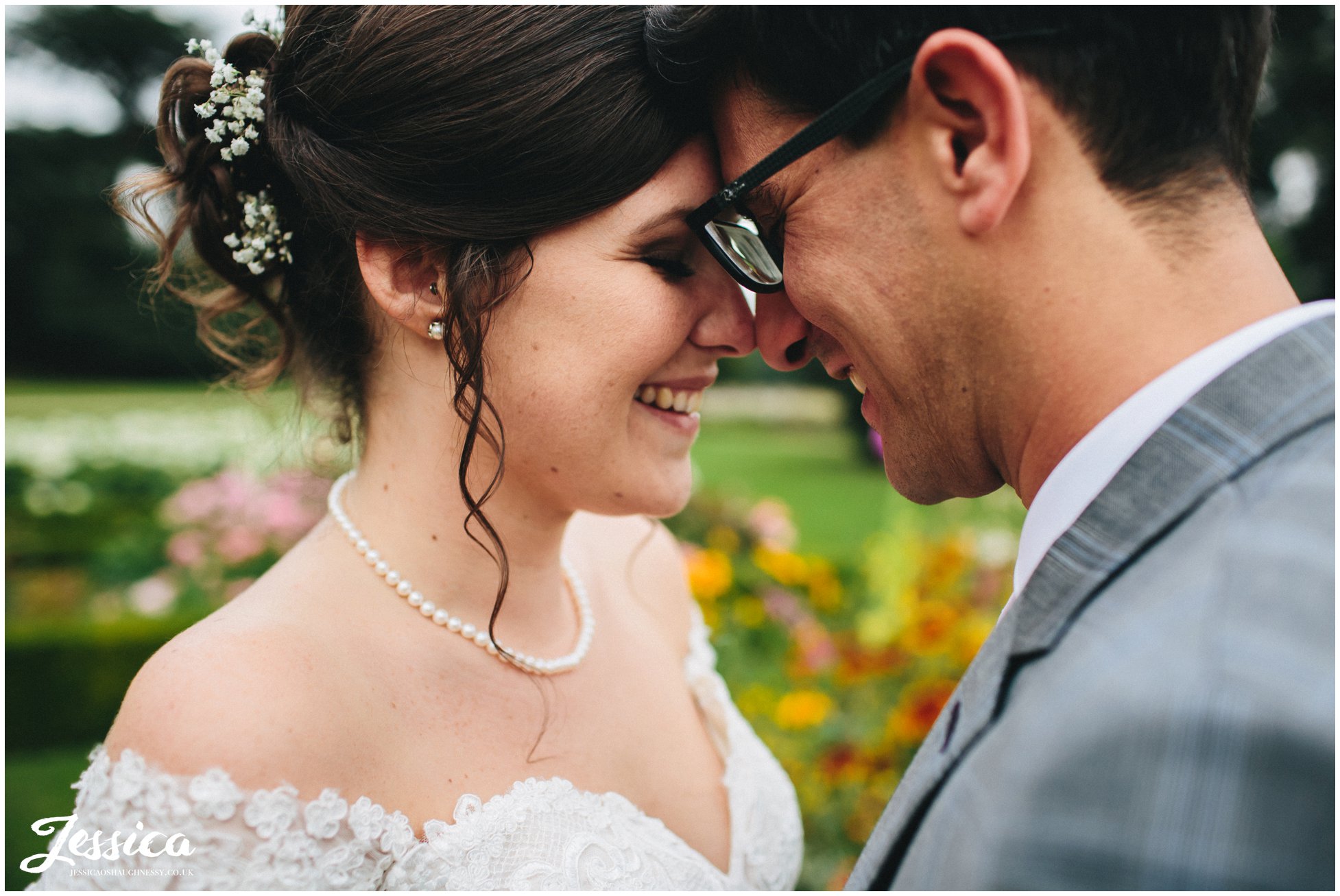 close up of bride and groom smiling - prestwold hall wedding photography