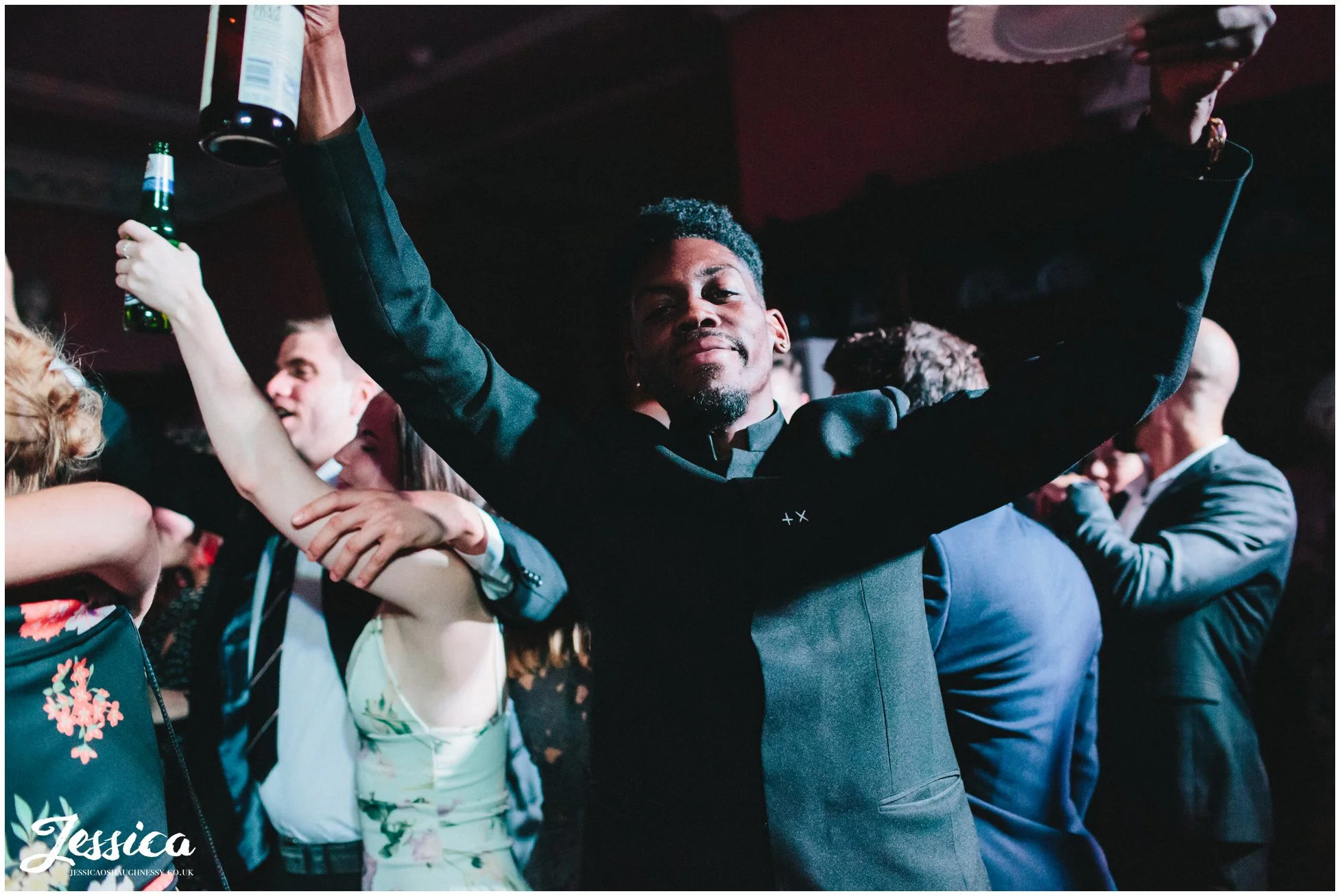 guests dance with hands in the air