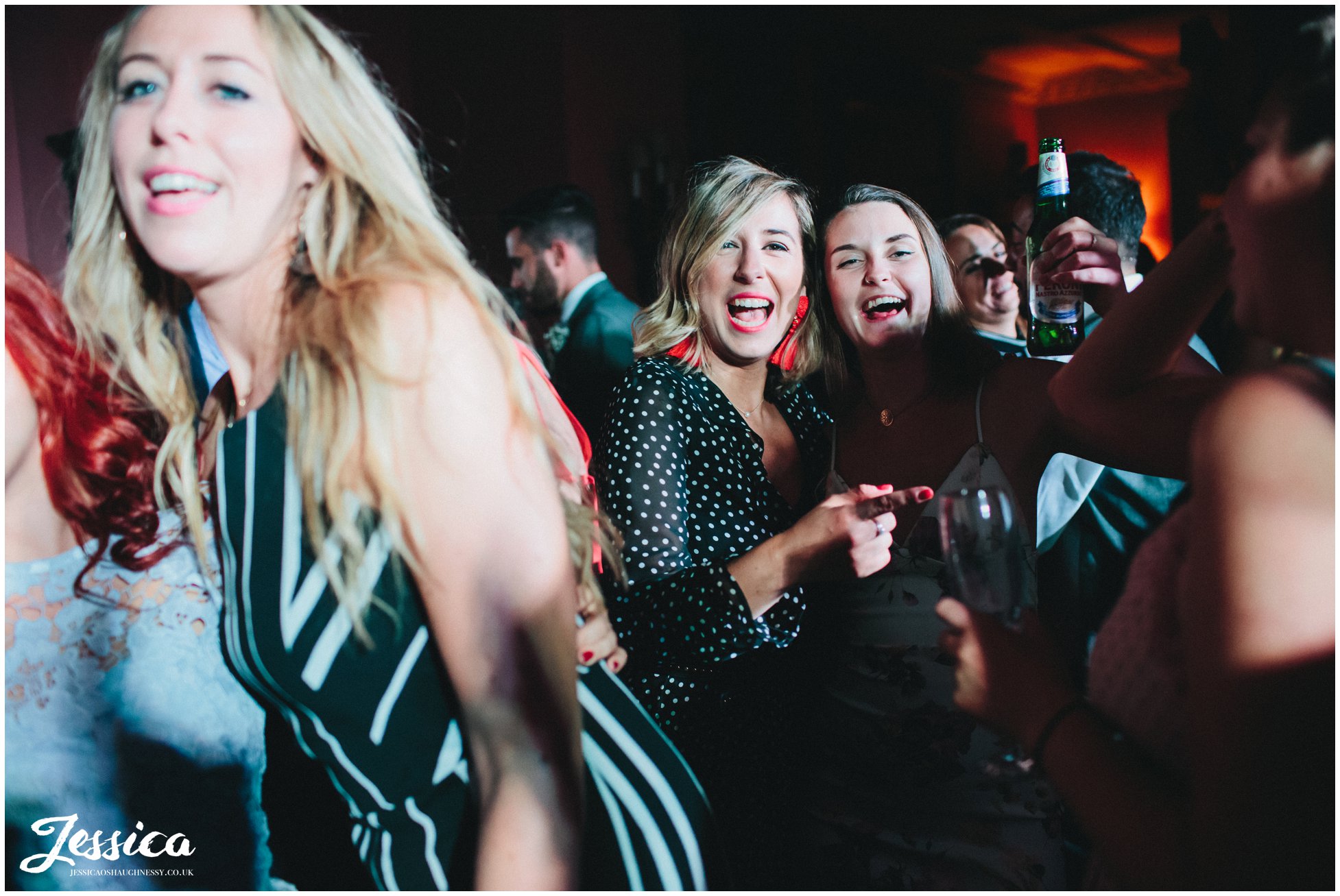 female guests dancing to wedding music