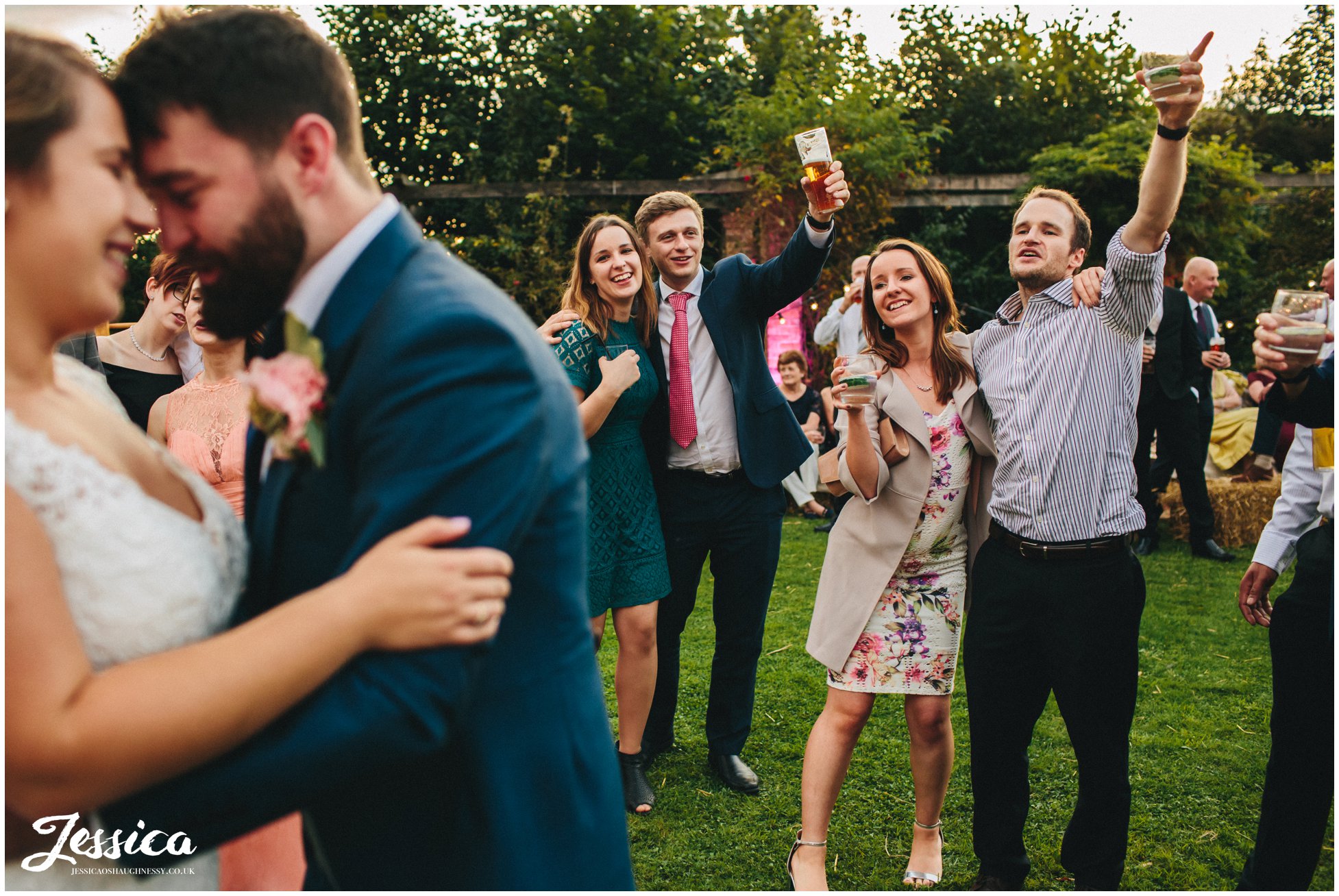 guests celebrating during the first dance