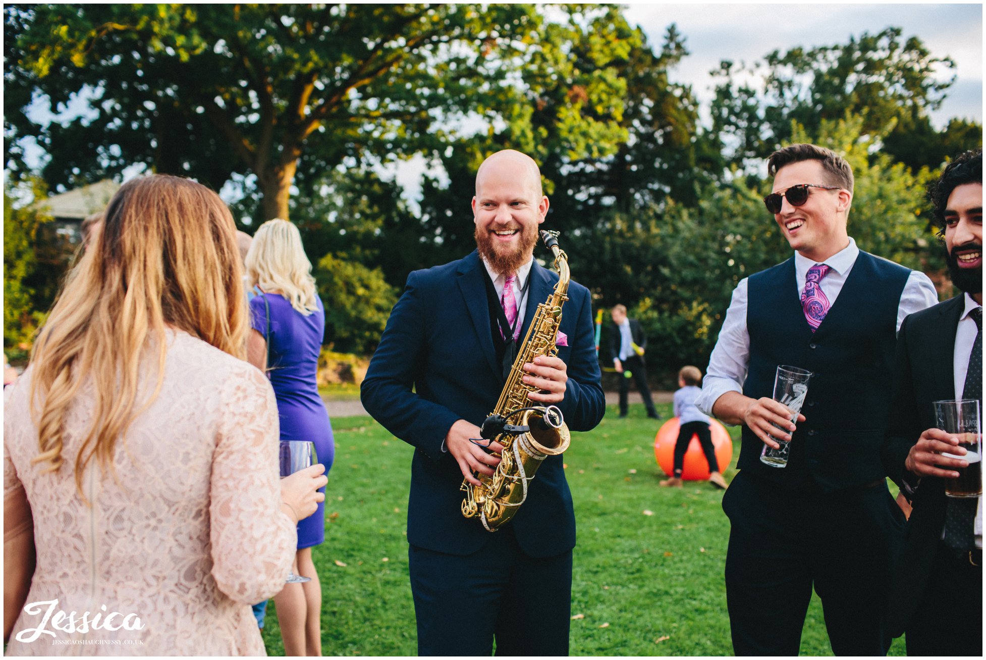 saxophone playing to guests outside willington hall